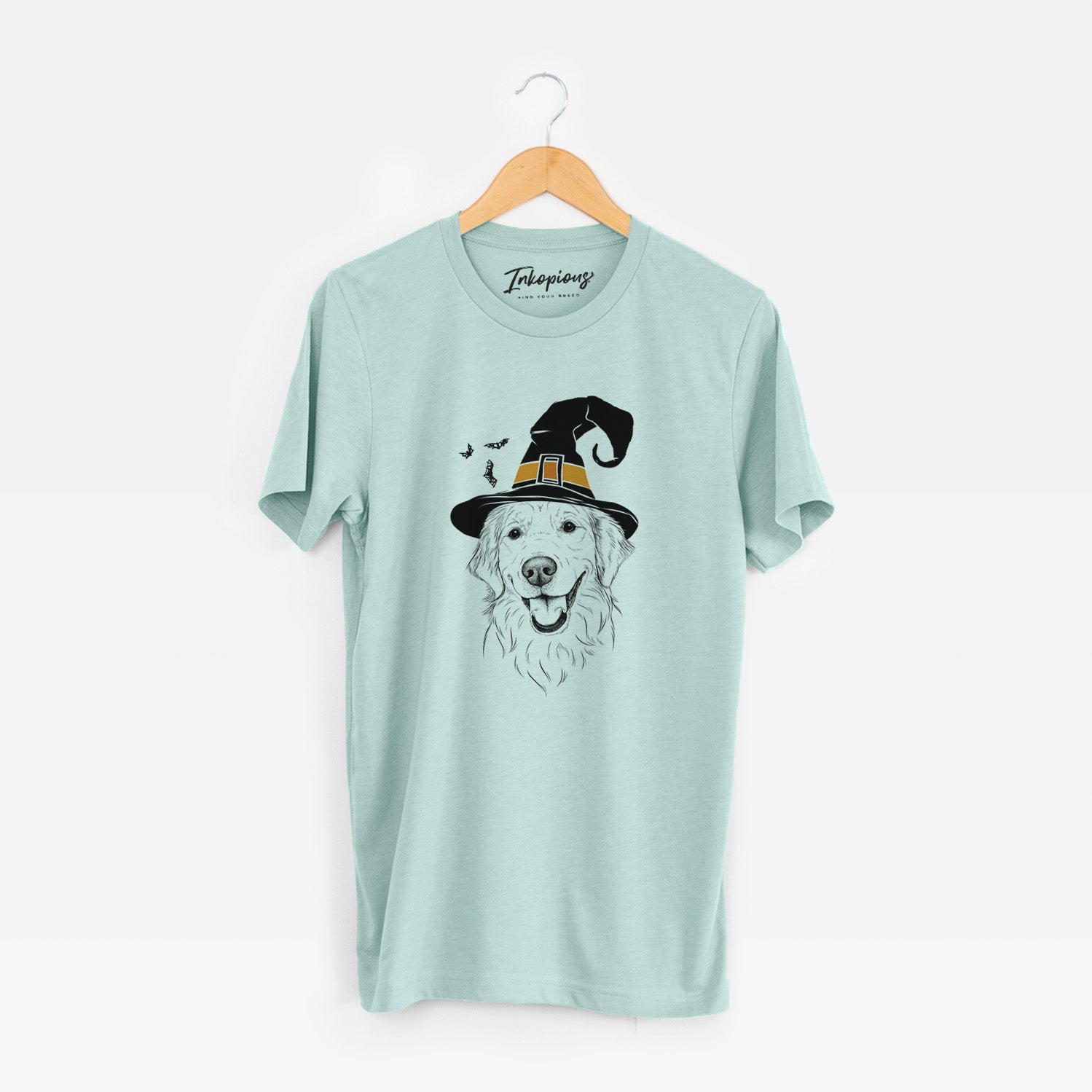 Hand-drawn sketch of Maple the Golden Retriever wearing a witch hat on a Heather Sage Unisex crewneck