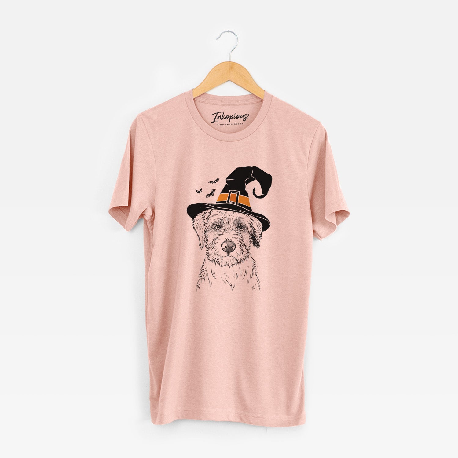 Hand-drawn sketch of Marek the Bernedoodle wearing a witch hat on a Peach Unisex crewneck