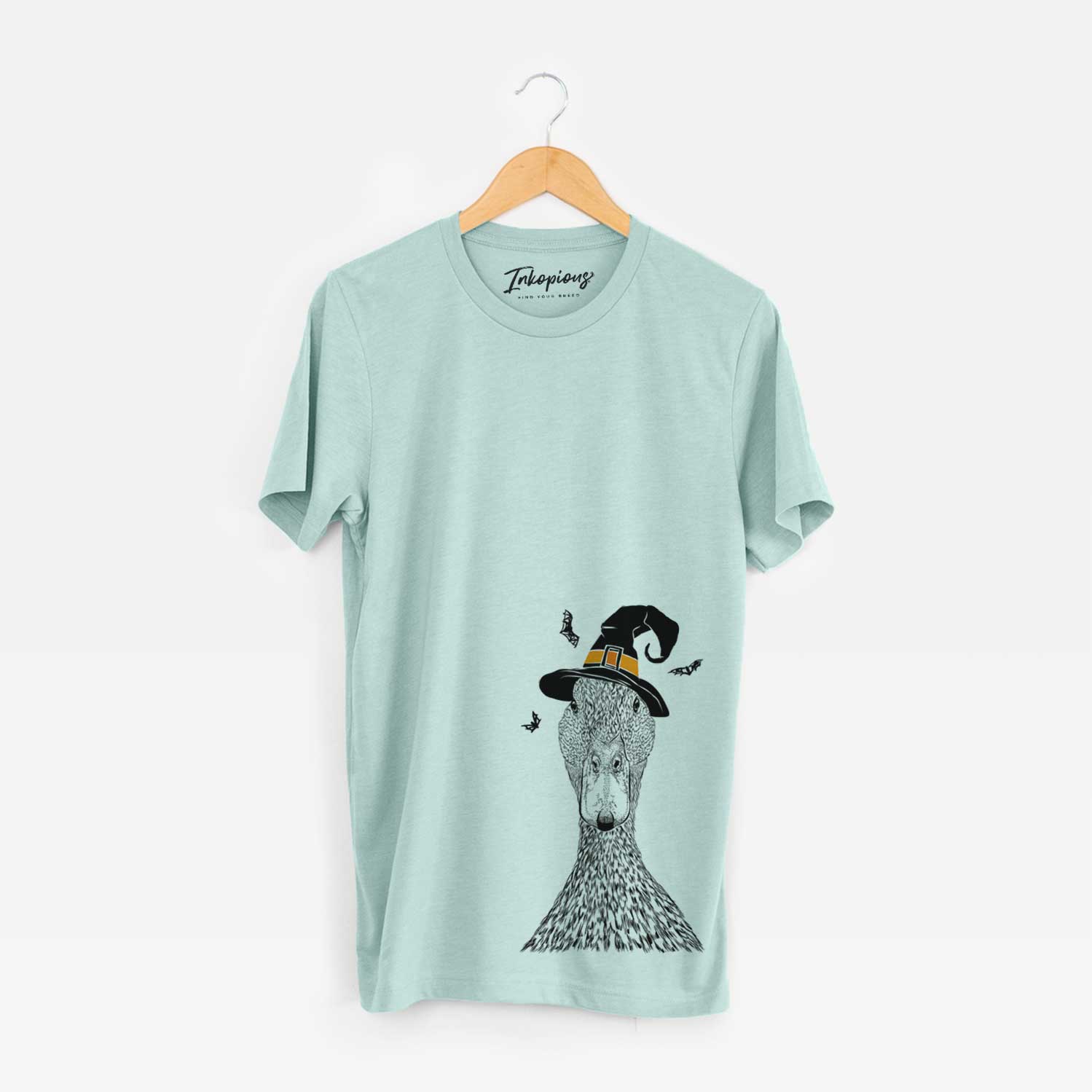 Hand-drawn sketch of Marge the Mallard Duck wearing a witch hat on a Heather Sage Unisex crewneck