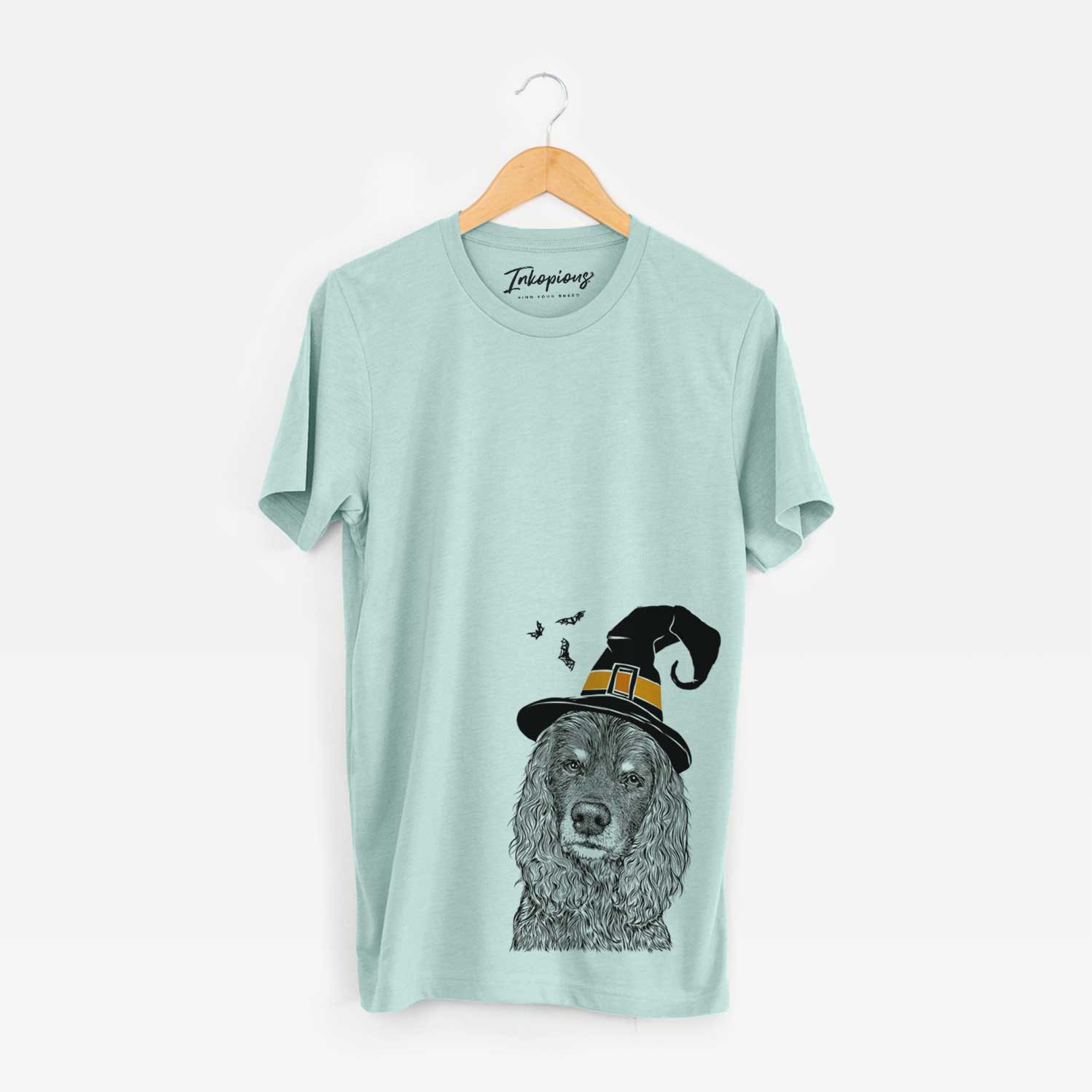 Hand-drawn sketch of Marley Boy the American Cocker Spaniel wearing a witch hat on a Heather Sage Unisex crewneck