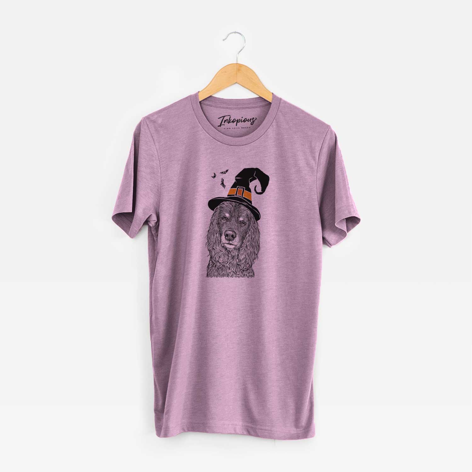 Hand-drawn sketch of Marley Boy the American Cocker Spaniel wearing a witch hat on an Orchid Unisex crewneck