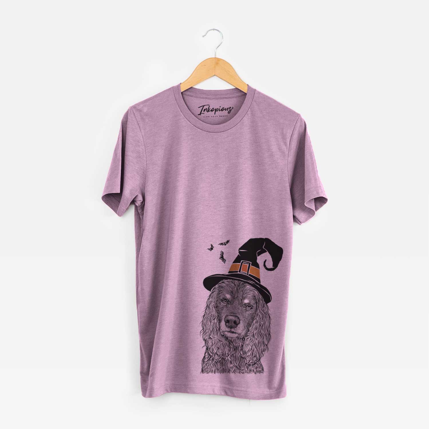 Hand-drawn sketch of Marley Boy the American Cocker Spaniel wearing a witch hat on an Orchid Unisex crewneck