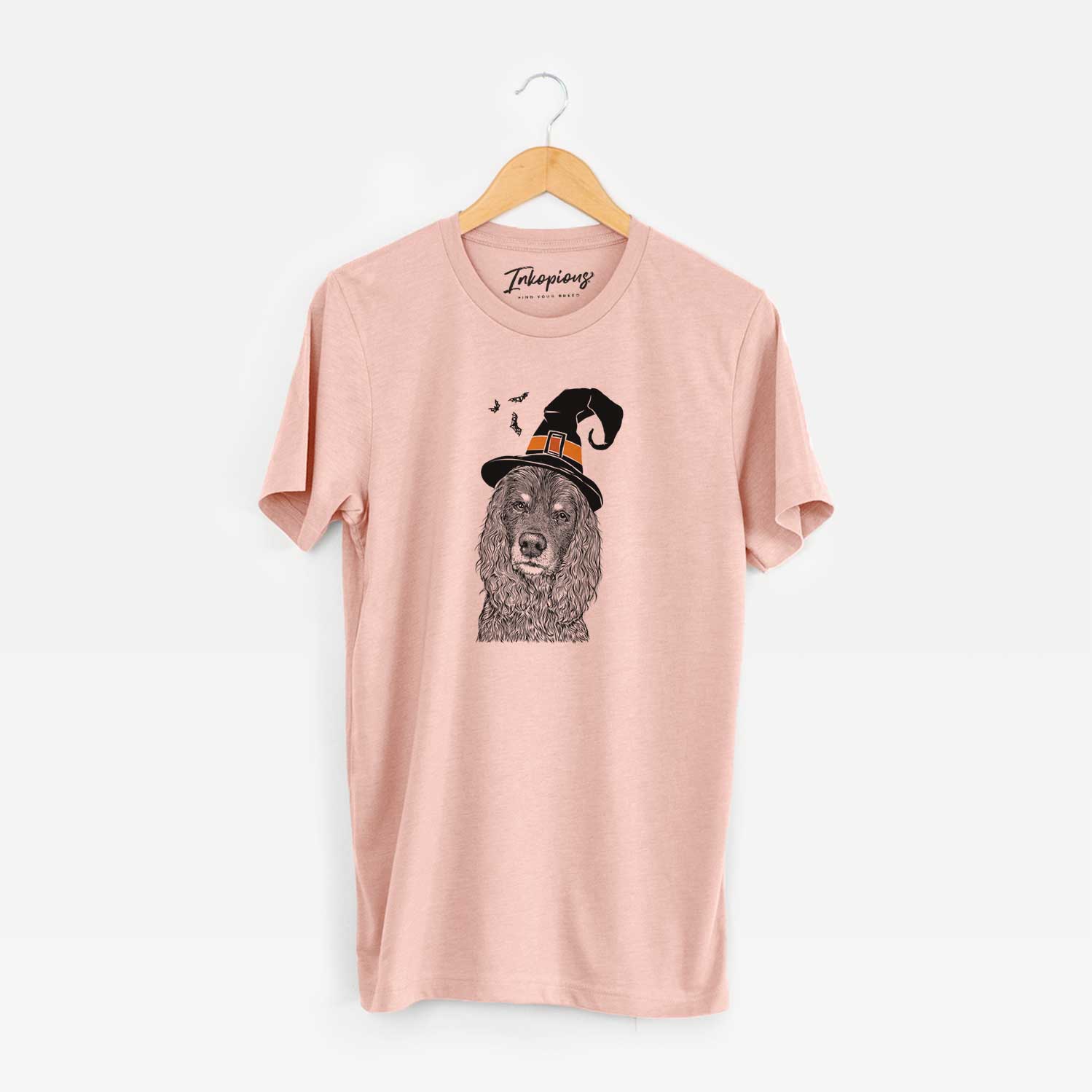 Hand-drawn sketch of Marley Boy the American Cocker Spaniel wearing a witch hat on a Peach Unisex crewneck