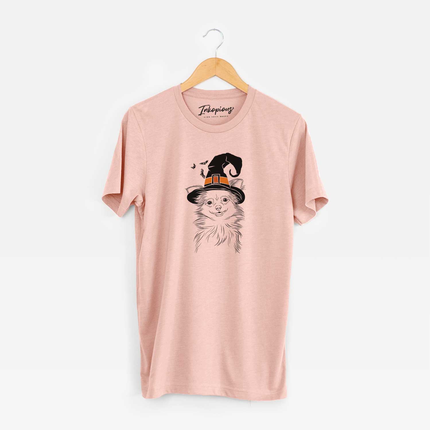 Hand-drawn sketch of Marzi the Long Haired Chihuahua wearing a witch hat on a Peach Unisex crewneck