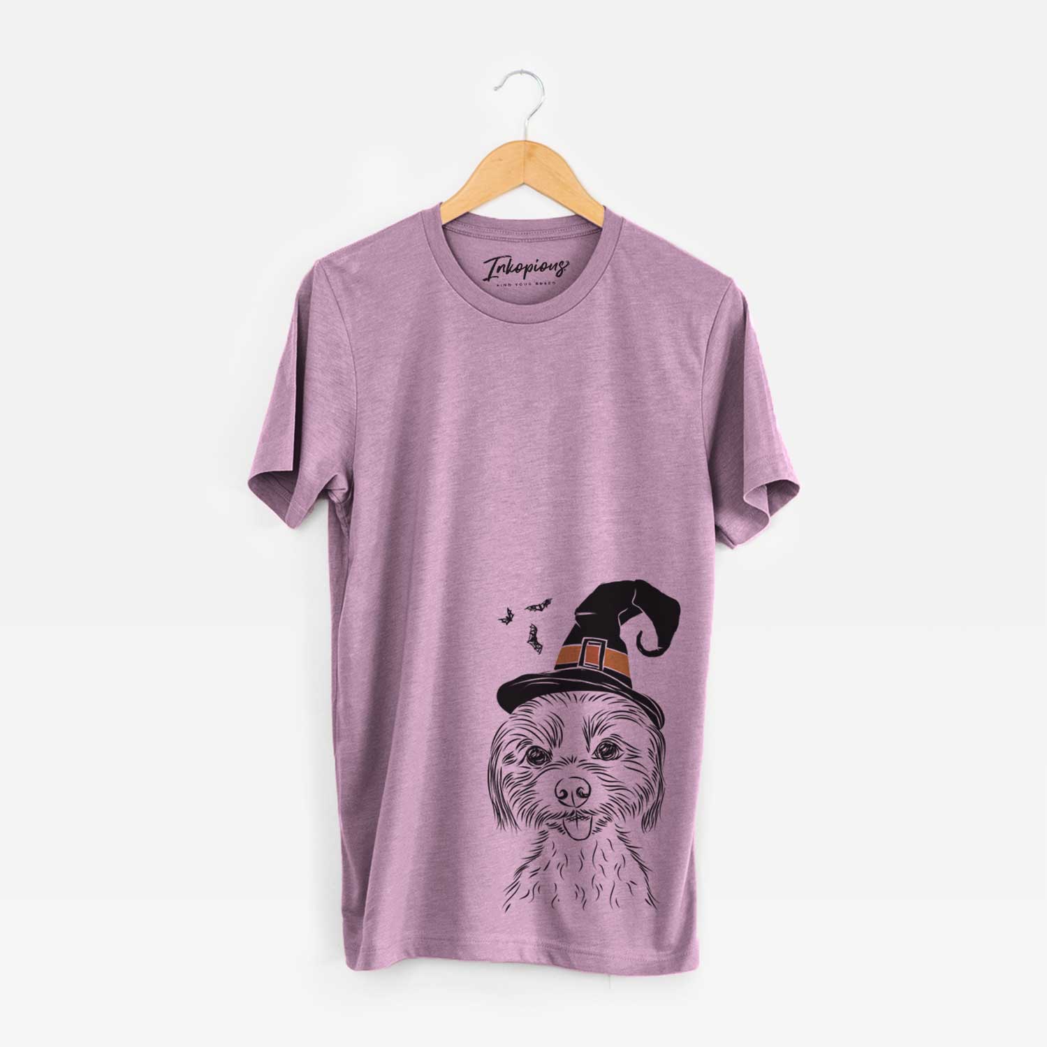 Hand-drawn sketch of Mater the Yorkshire Terrier wearing a witch hat on an Orchid Unisex crewneck