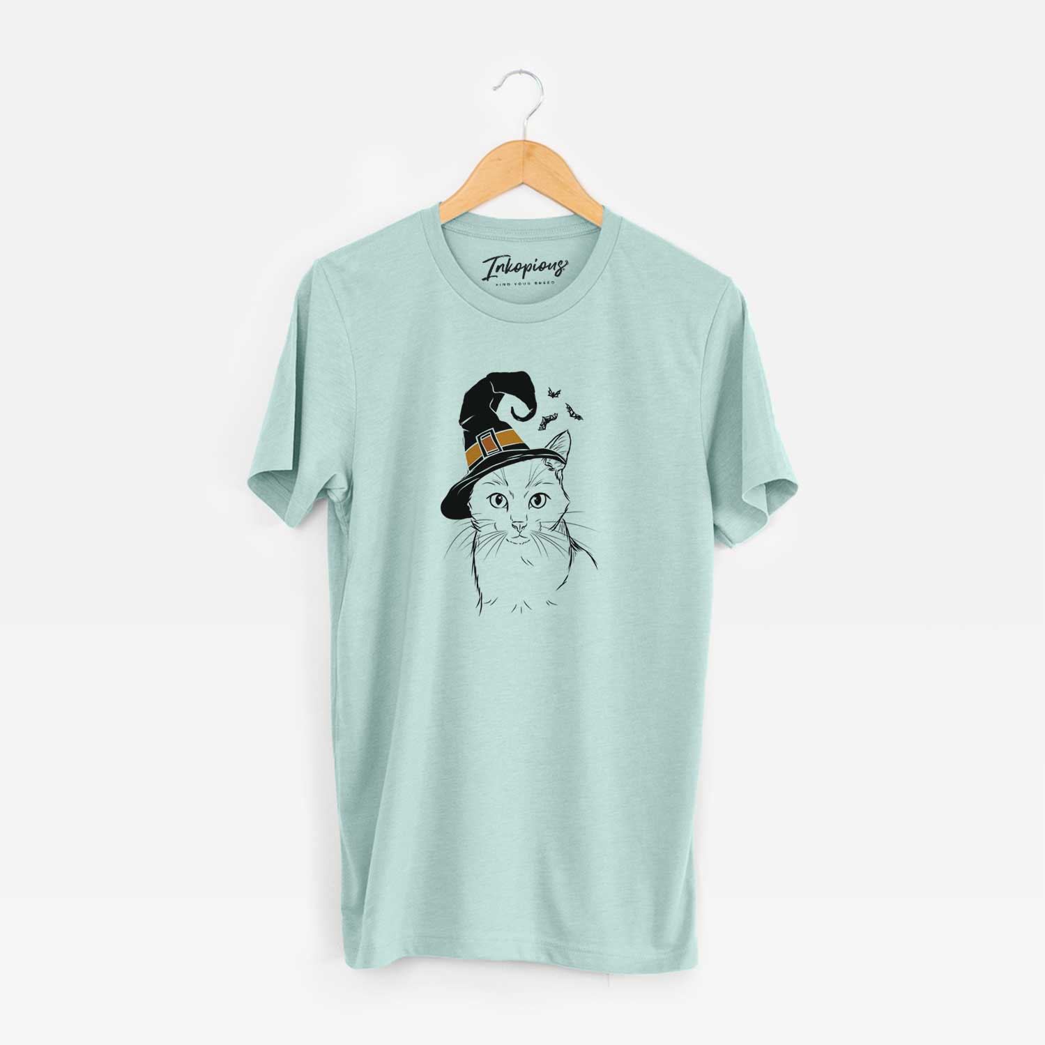 Hand-drawn sketch of Maverick the Cat wearing a witch hat on a Heather Sage Unisex crewneck