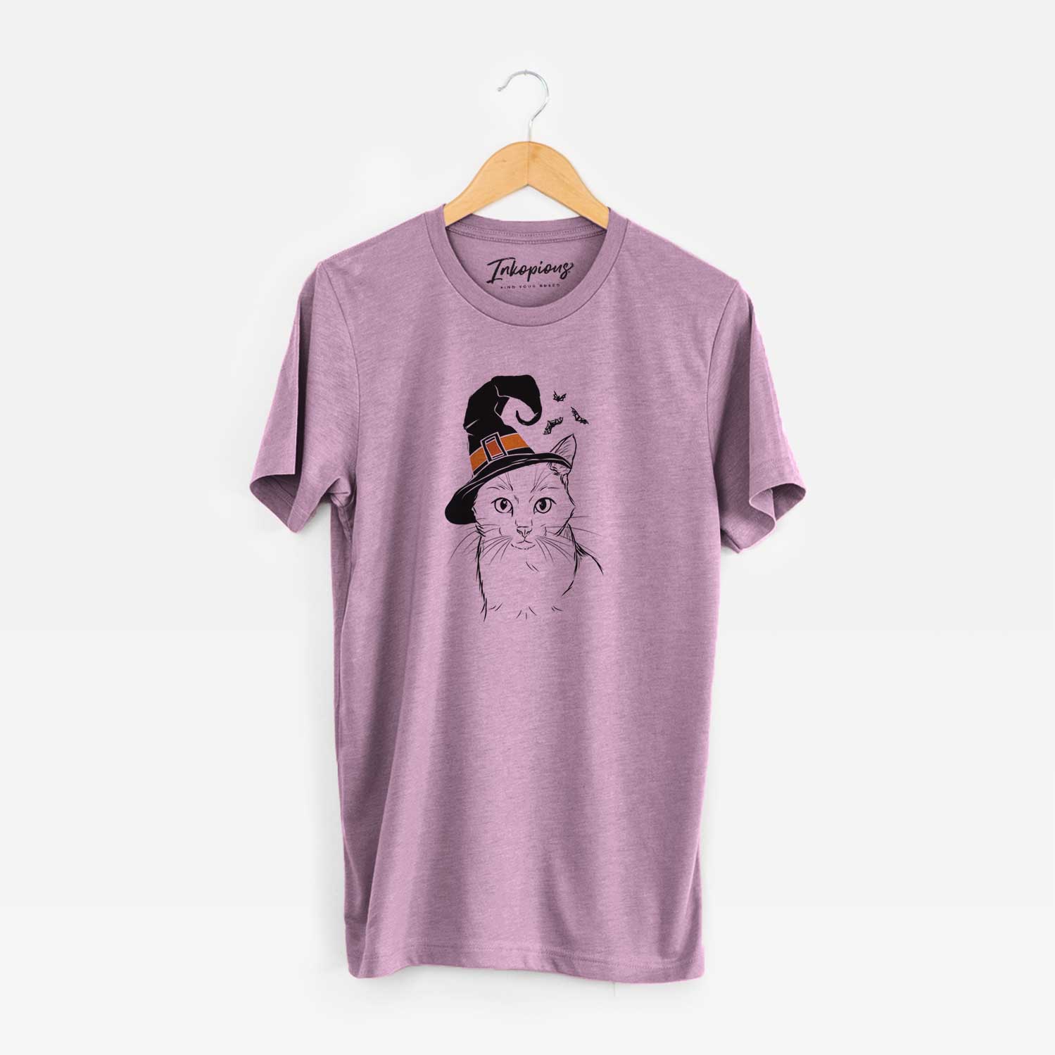 Hand-drawn sketch of Maverick the Cat wearing a witch hat on an Orchid Unisex crewneck