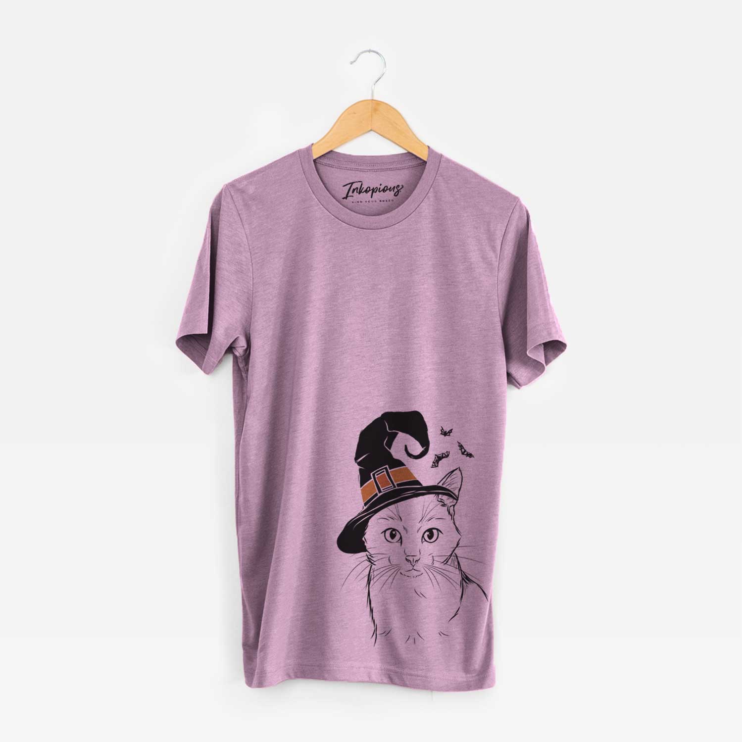 Hand-drawn sketch of Maverick the Cat wearing a witch hat on an Orchid Unisex crewneck