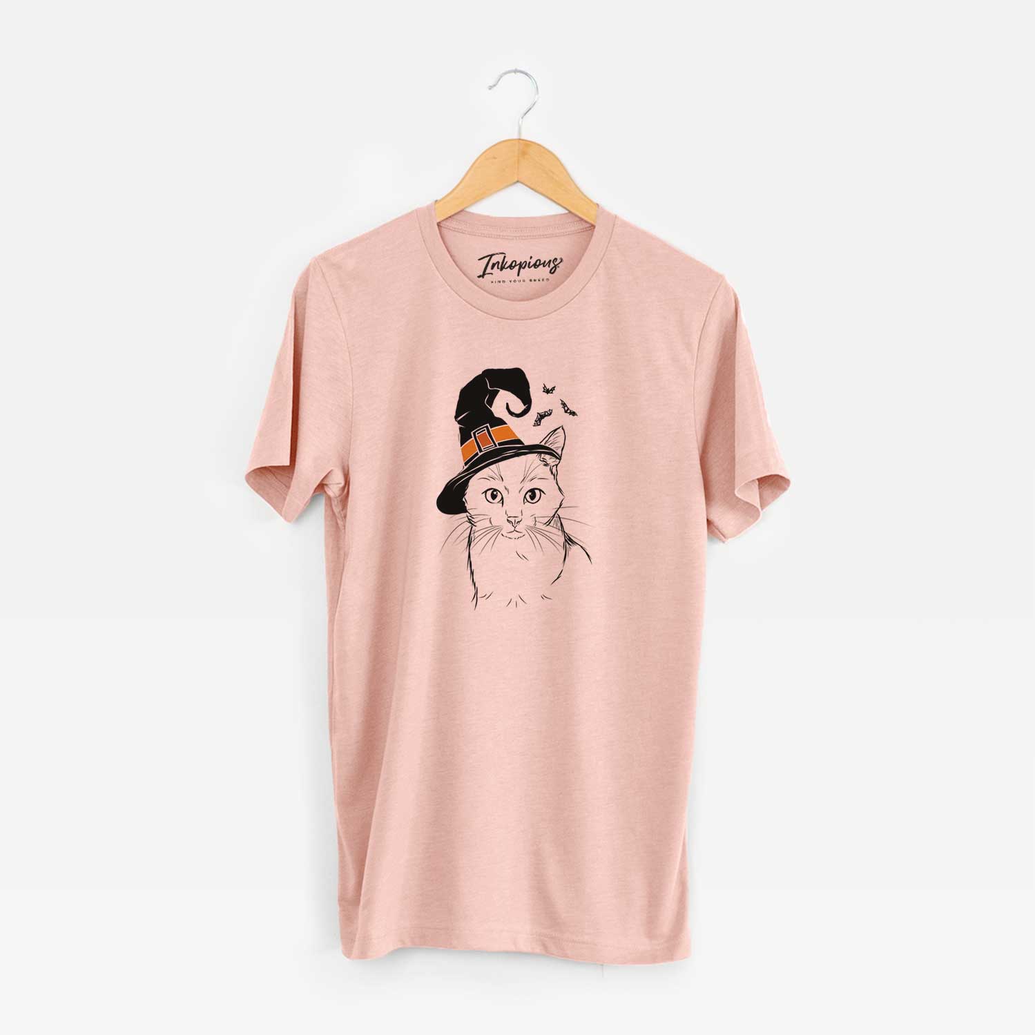 Hand-drawn sketch of Maverick the Cat wearing a witch hat on a Peach Unisex crewneck