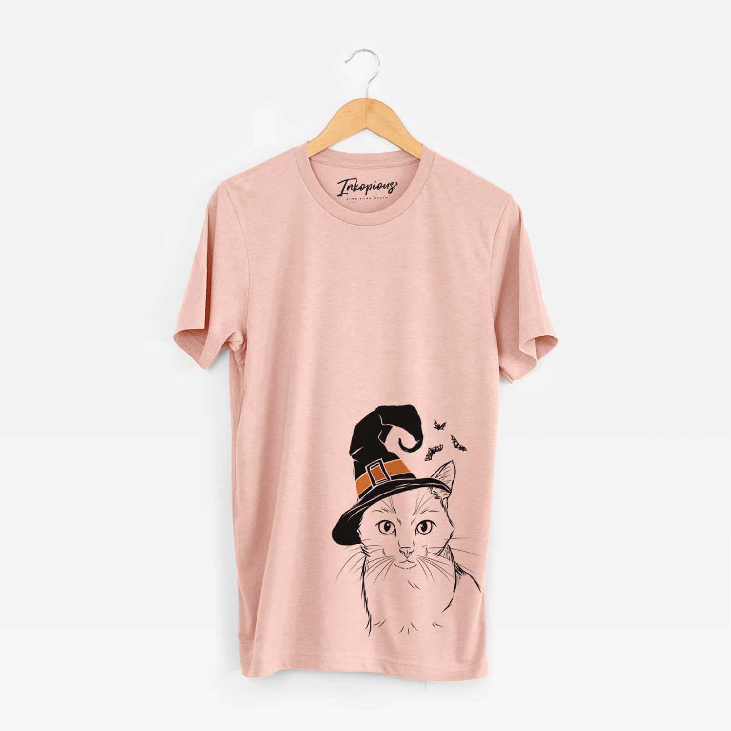 Hand-drawn sketch of Maverick the Cat wearing a witch hat on a Peach Unisex crewneck