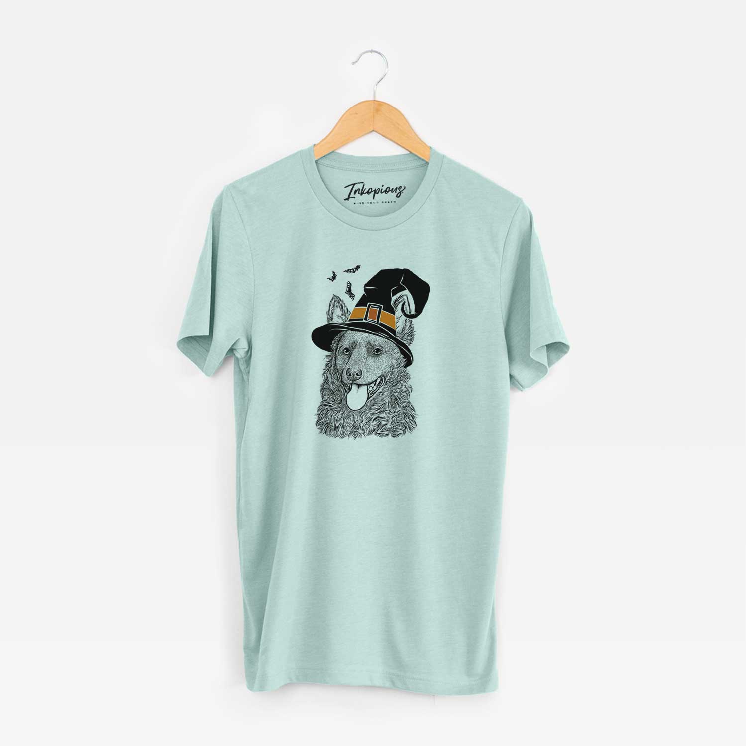 Hand-drawn sketch of Maximo the Mudi wearing a witch hat on a Heather Sage Unisex crewneck