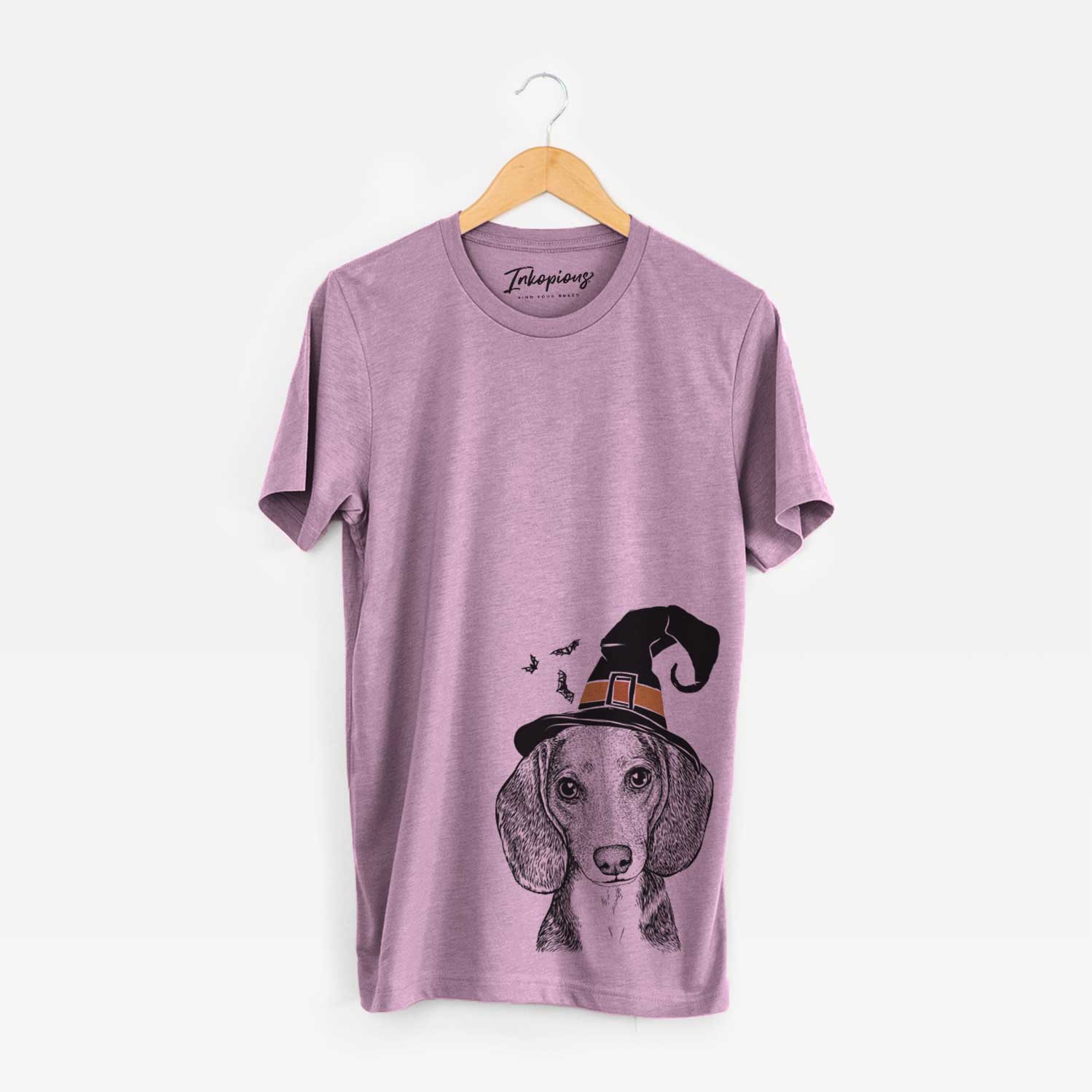Hand-drawn sketch of Mayor Andy the Beagle wearing a witch hat on an Orchid Unisex crewneck