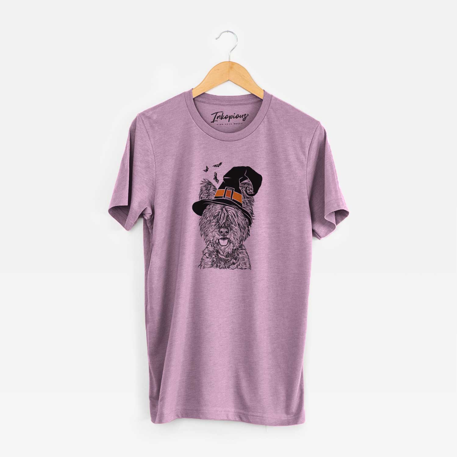 Hand-drawn sketch of McDuff the Cairn Terrier wearing a witch hat on an Orchid Unisex crewneck