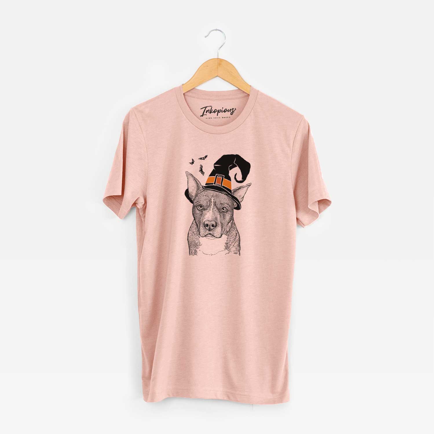 Hand-drawn sketch of Mercy the Pitbull wearing a witch hat on a Peach Unisex crewneck