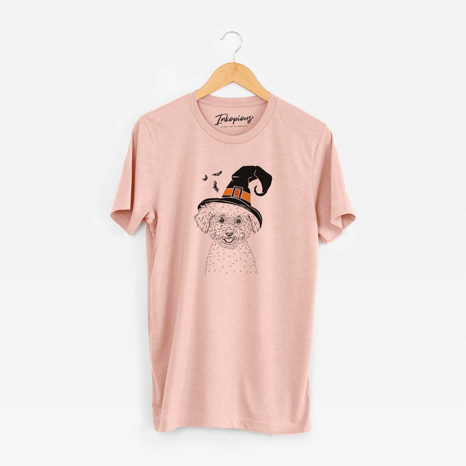 Hand-drawn sketch of Mickey the Bichon Frise wearing a witch hat on a Peach Unisex crewneck