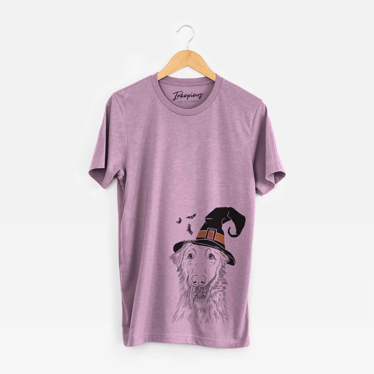 Hand-drawn sketch of Mila the Mixed Breed wearing a witch hat on an Orchid Unisex crewneck