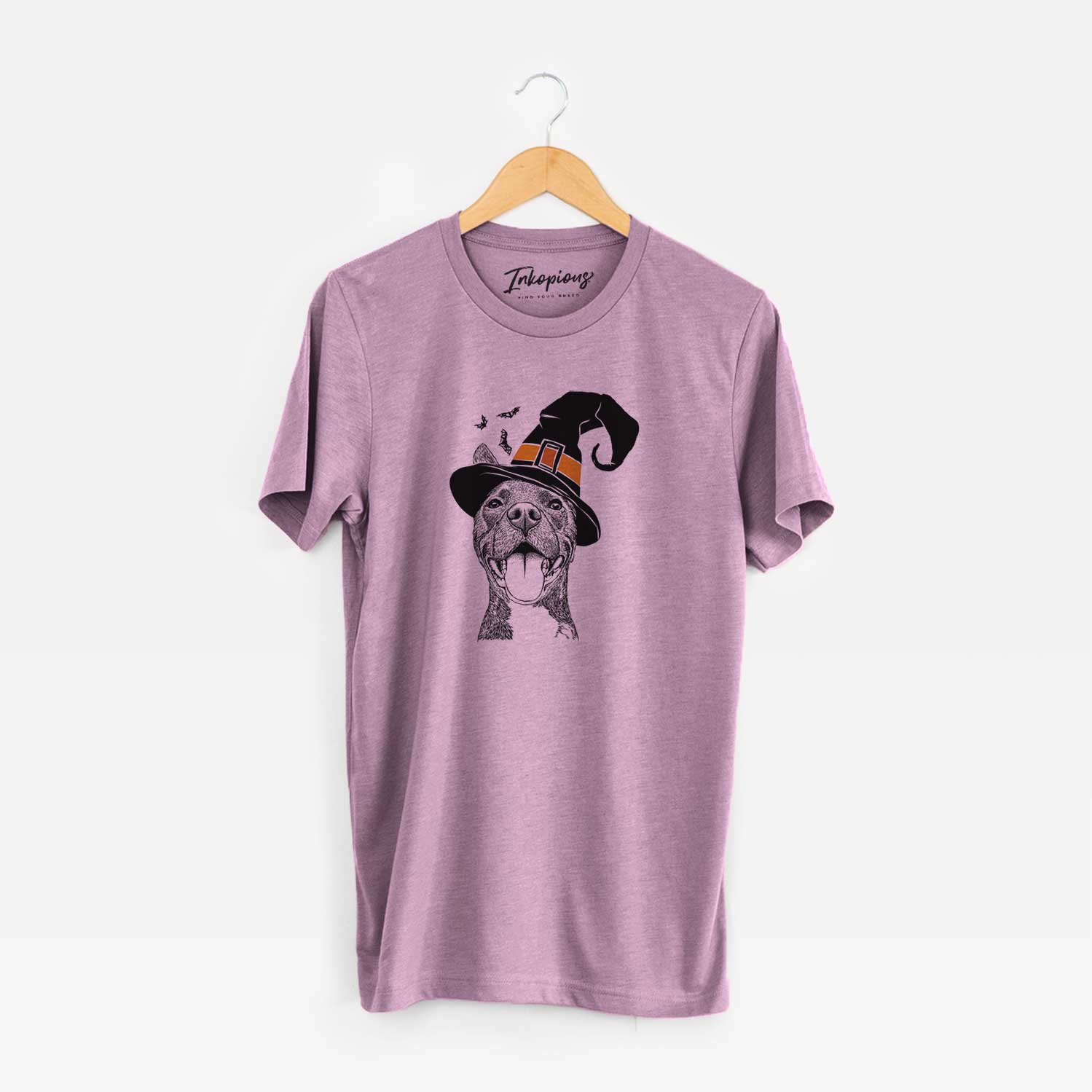Hand-drawn sketch of Milo the Pitbull Mix wearing a witch hat on an Orchid Unisex crewneck