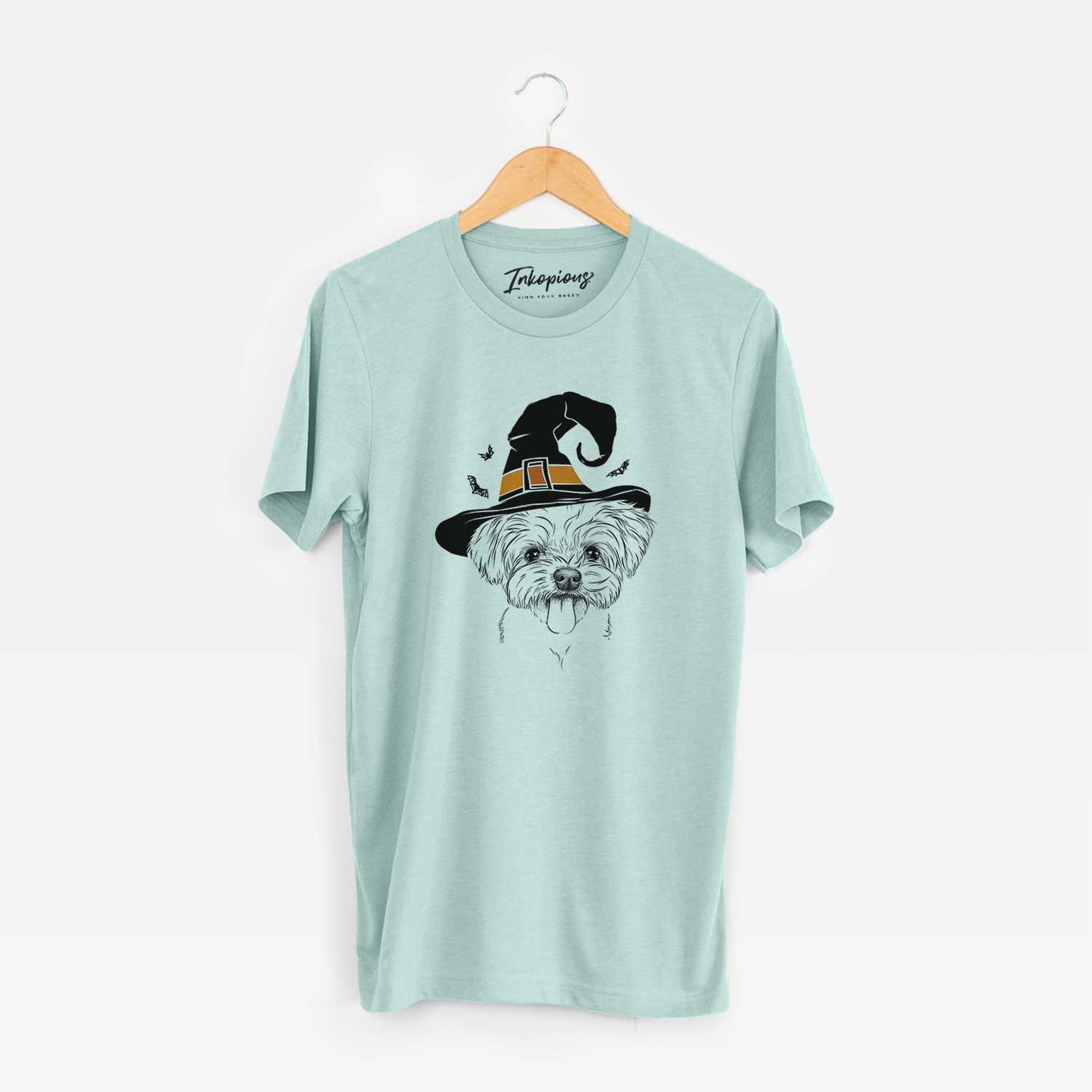 Hand-drawn sketch of Mochi the Maltese wearing a witch hat on a Heather Sage Unisex crewneck