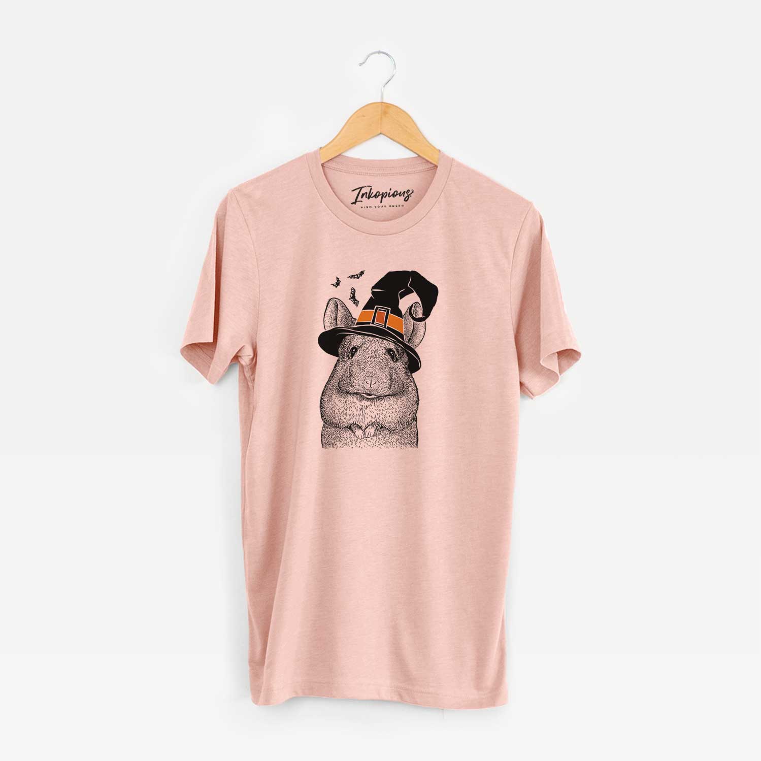 Hand-drawn sketch of Mojo the Chinchilla wearing a witch hat on a Peach Unisex crewneck
