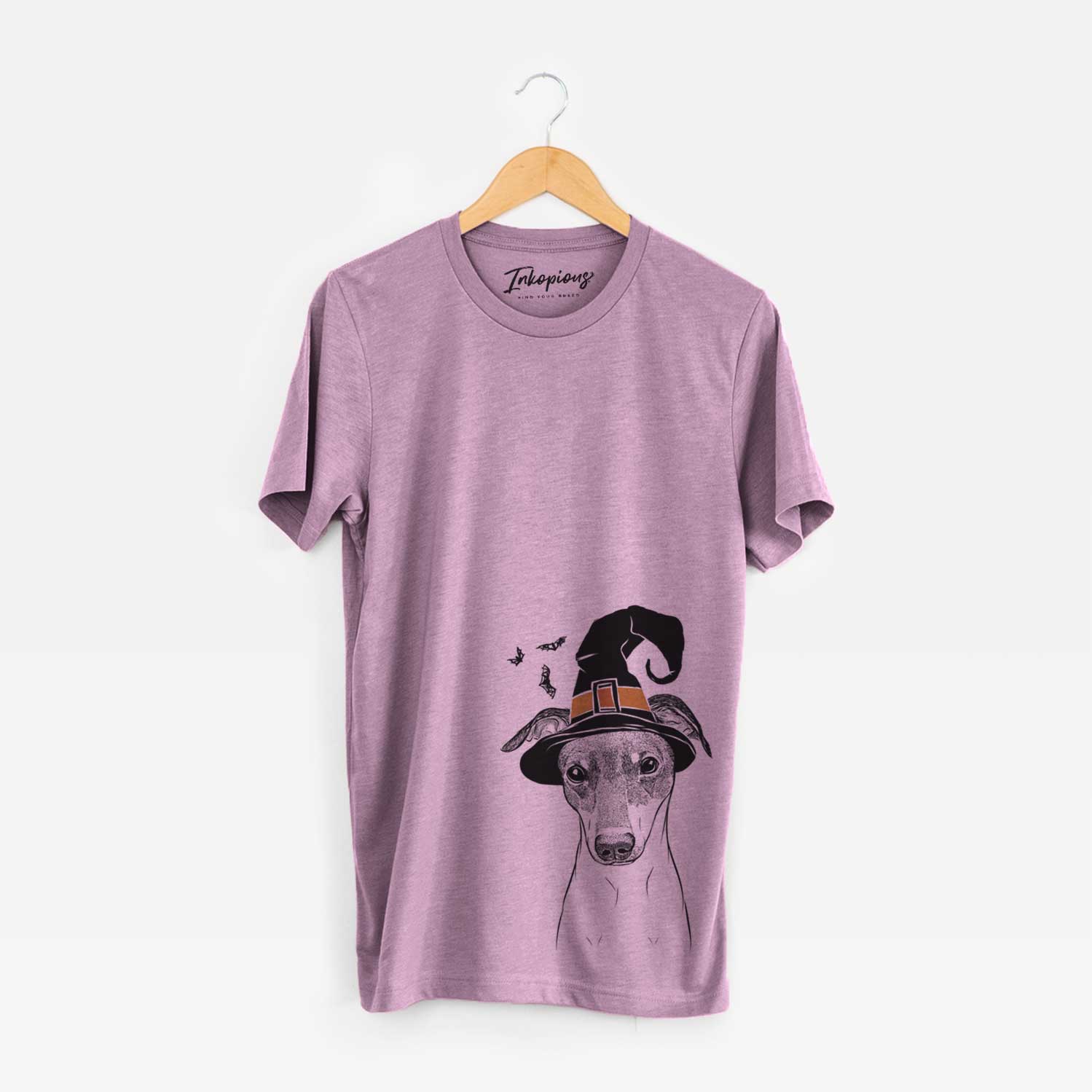 Hand-drawn sketch of Momo the Japanese Terrier wearing a witch hat on an Orchid Unisex crewneck