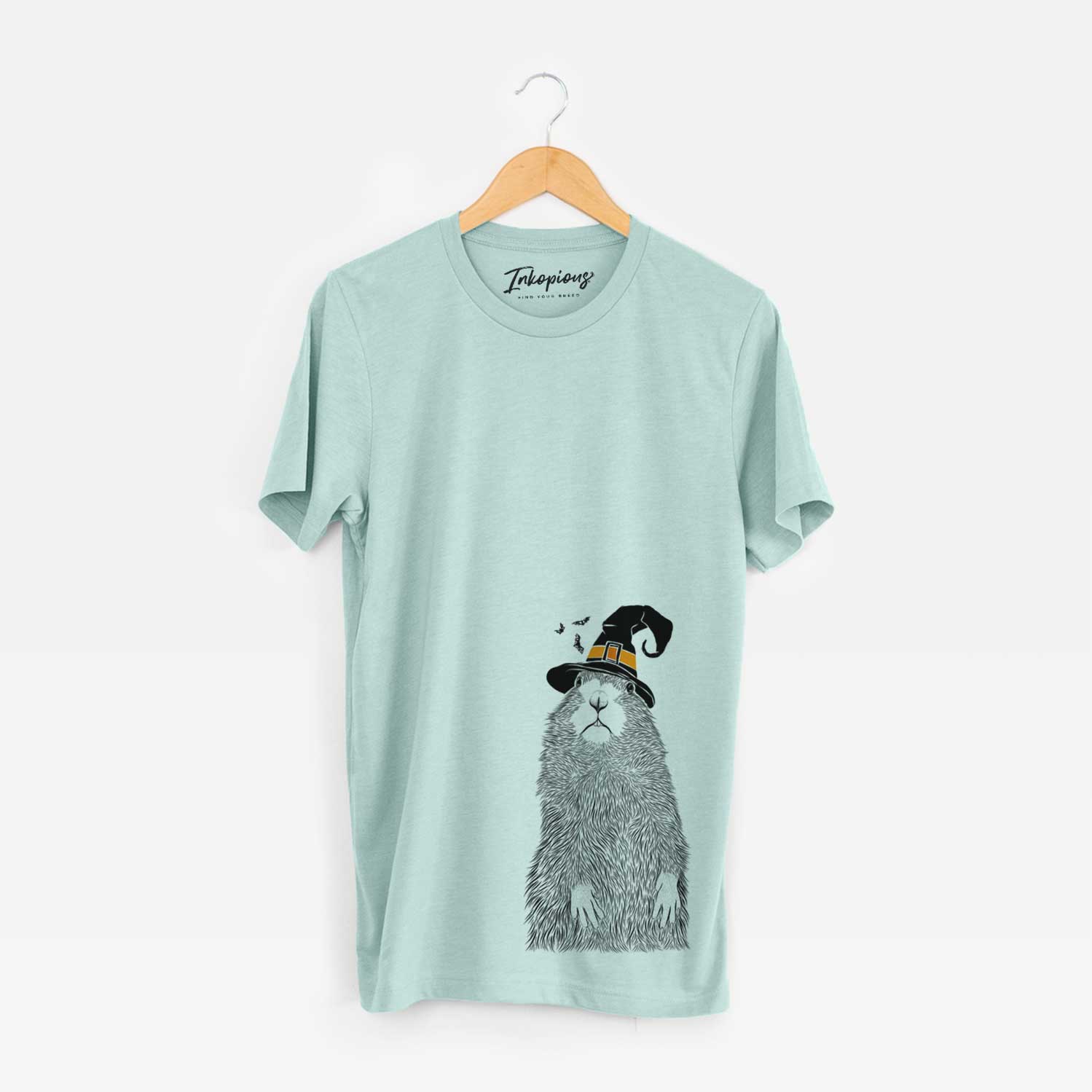 Hand-drawn sketch of Mr. Otis the Prairie Dog wearing a witch hat on a Heather Sage Unisex crewneck