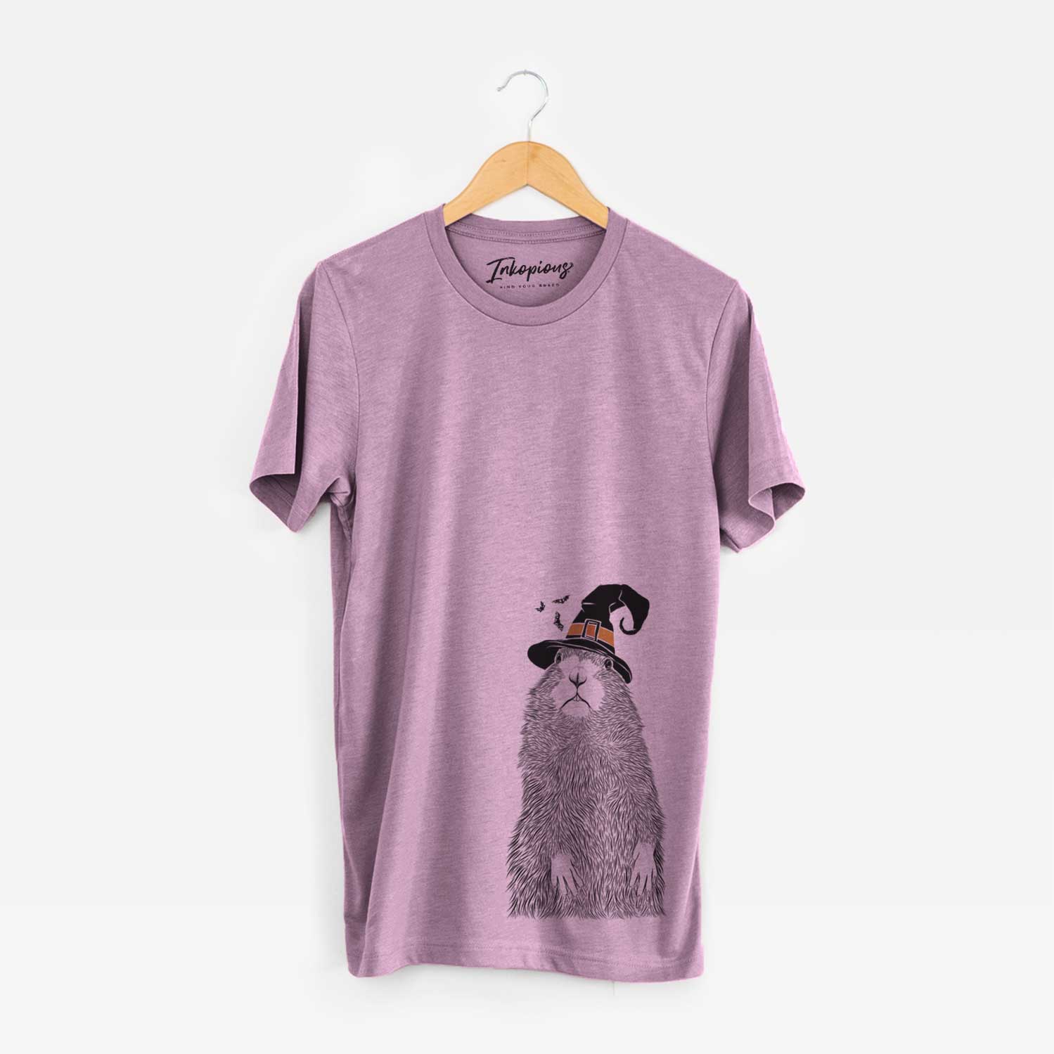 Hand-drawn sketch of Mr. Otis the Prairie Dog wearing a witch hat on an Orchid Unisex crewneck