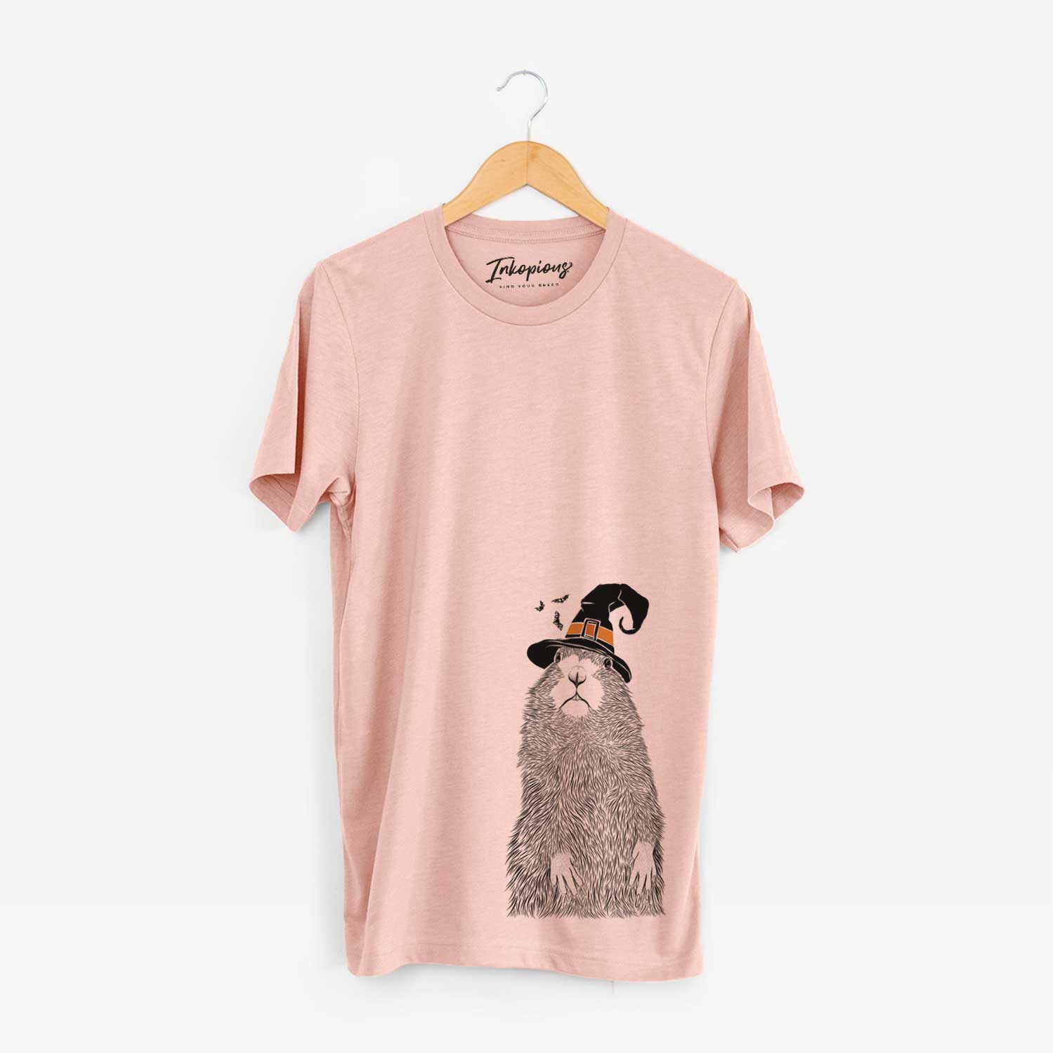 Hand-drawn sketch of Mr. Otis the Prairie Dog wearing a witch hat on a Peach Unisex crewneck