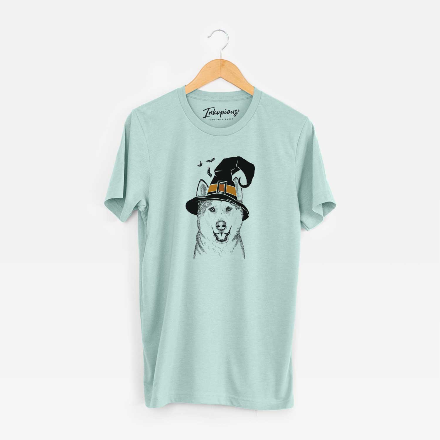 Hand-drawn sketch of Nika the Siberian Husky wearing a witch hat on a Heather Sage Unisex crewneck