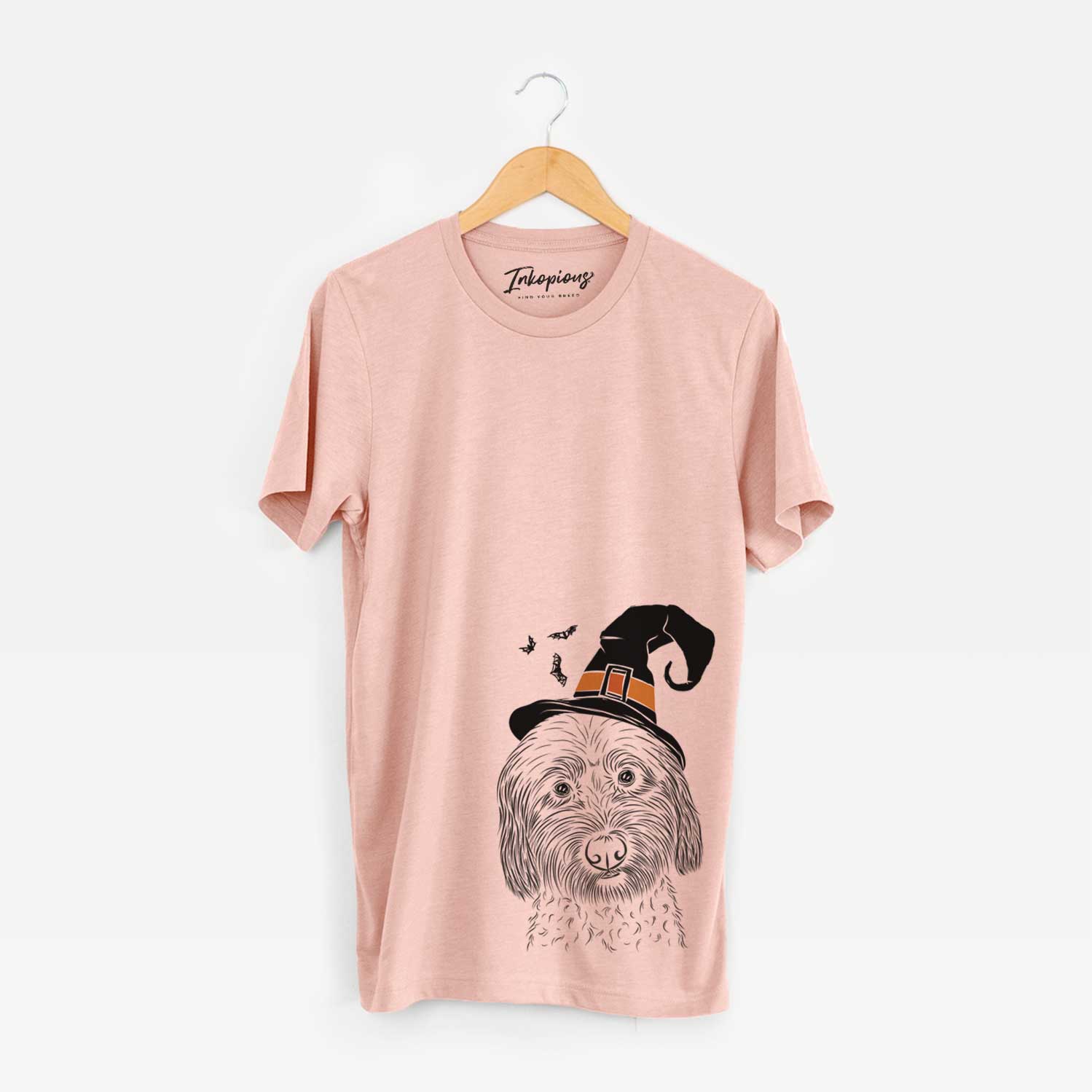 Hand-drawn sketch of Niles the Soft Coated Wheaten Terrier wearing a witch hat on a Peach Unisex crewneck