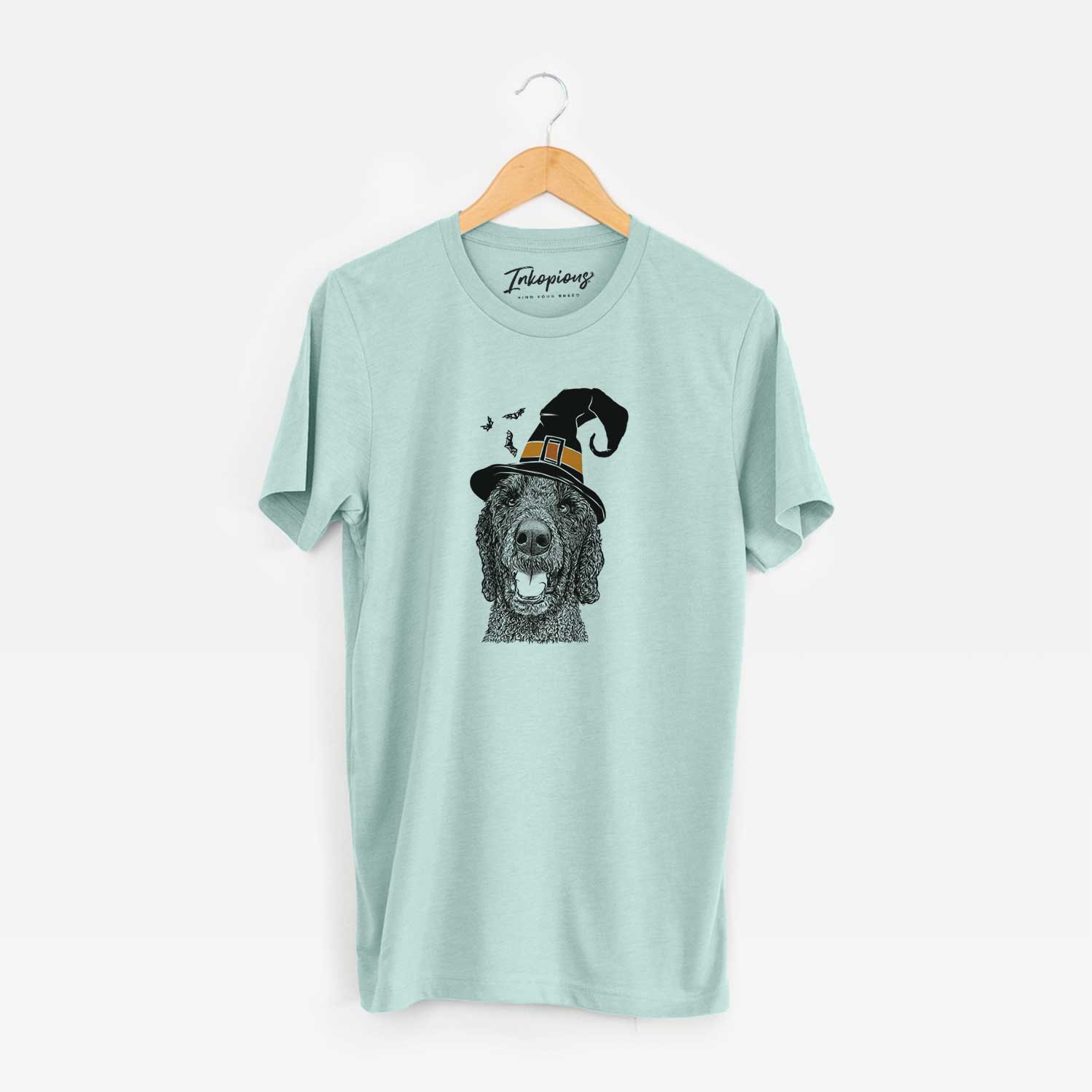Hand-drawn sketch of Obi James the Goldendoodle wearing a witch hat on a Heather Sage Unisex crewneck