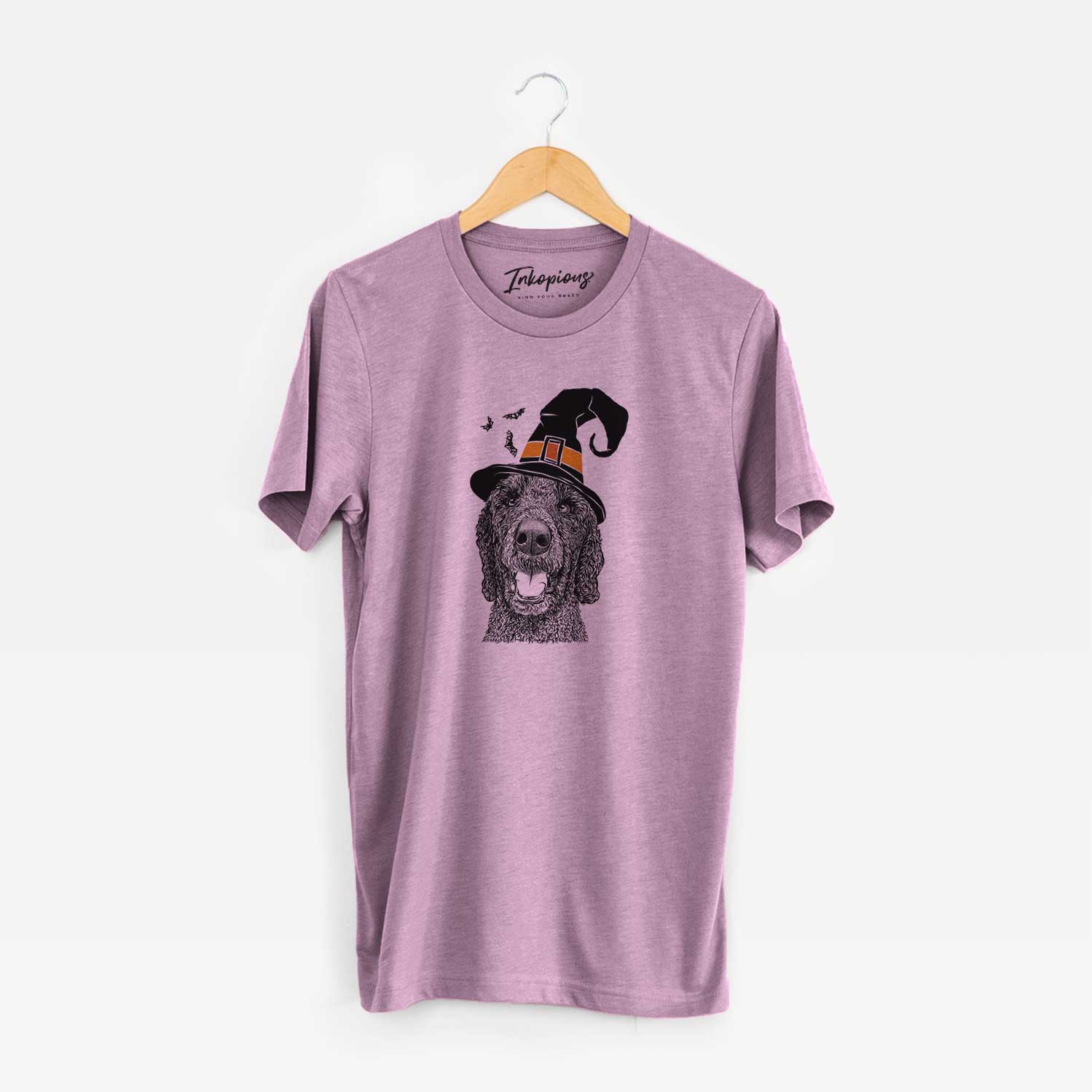 Hand-drawn sketch of Obi James the Goldendoodle wearing a witch hat on an Orchid Unisex crewneck