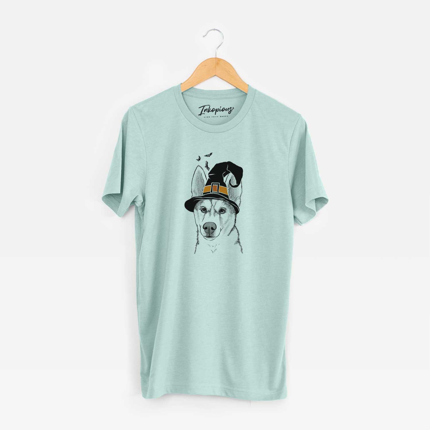 Hand-drawn sketch of Odin the Siberian Husky wearing a witch hat on a Heather Sage Unisex crewneck