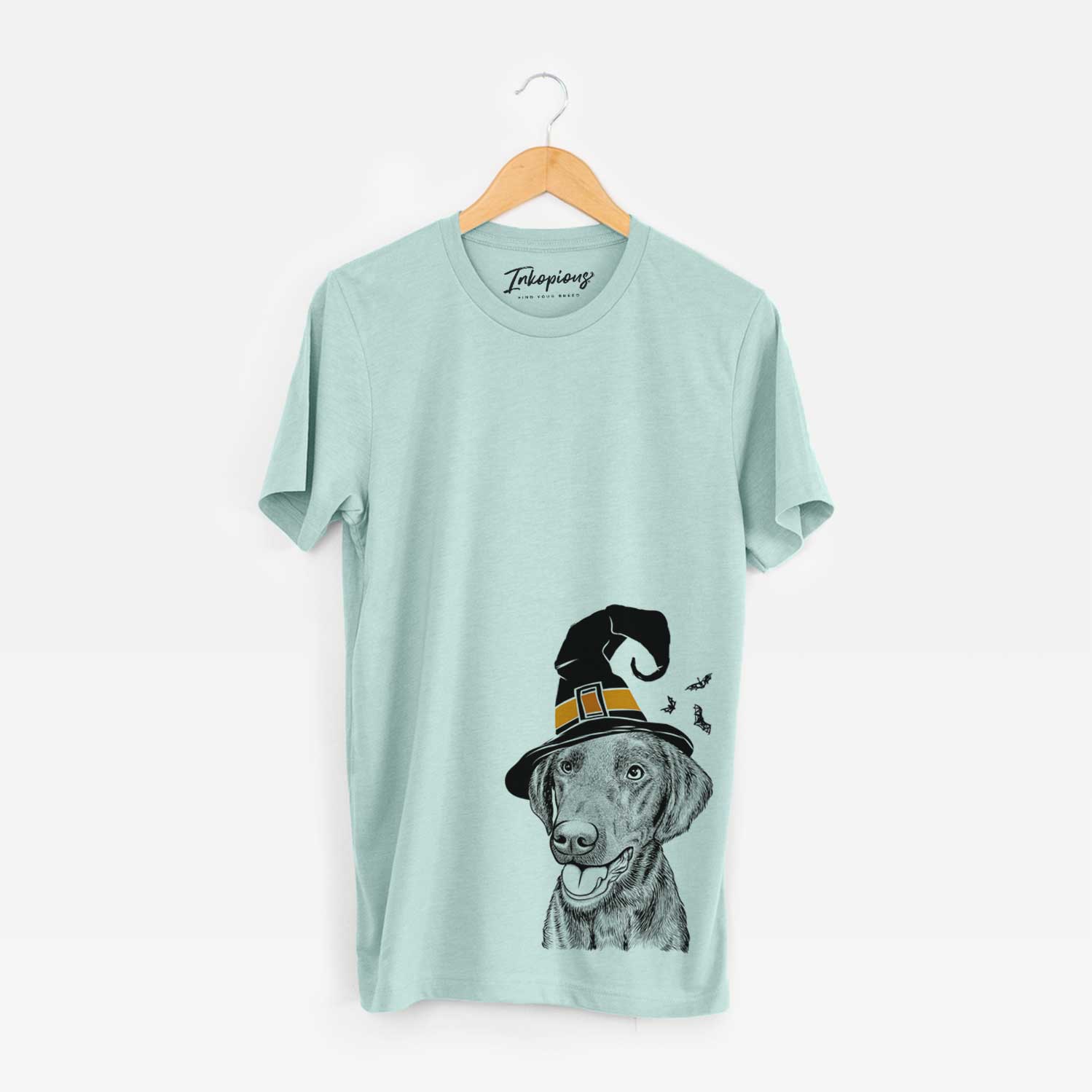 Hand-drawn sketch of Onyx the Labrador Retriever wearing a witch hat on a Heather Sage Unisex crewneck