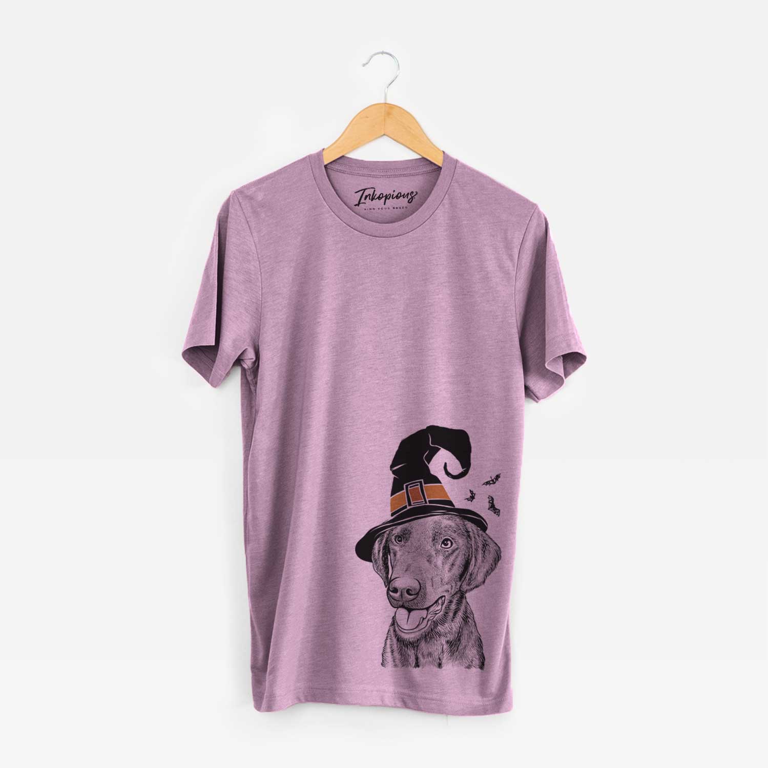 Hand-drawn sketch of Onyx the Labrador Retriever wearing a witch hat on an Orchid Unisex crewneck
