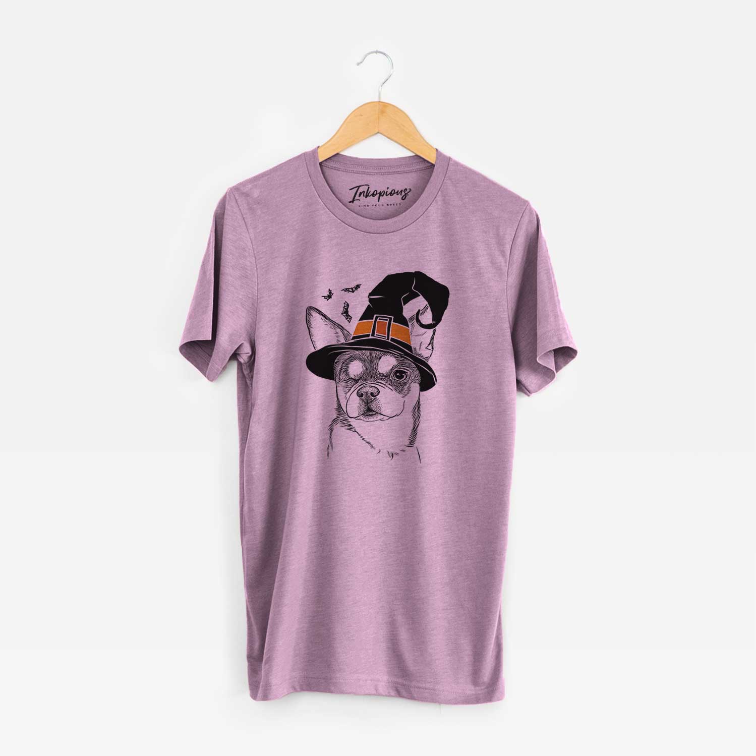Hand-drawn sketch of Paris the Chihuahua wearing a witch hat on an Orchid Unisex crewneck
