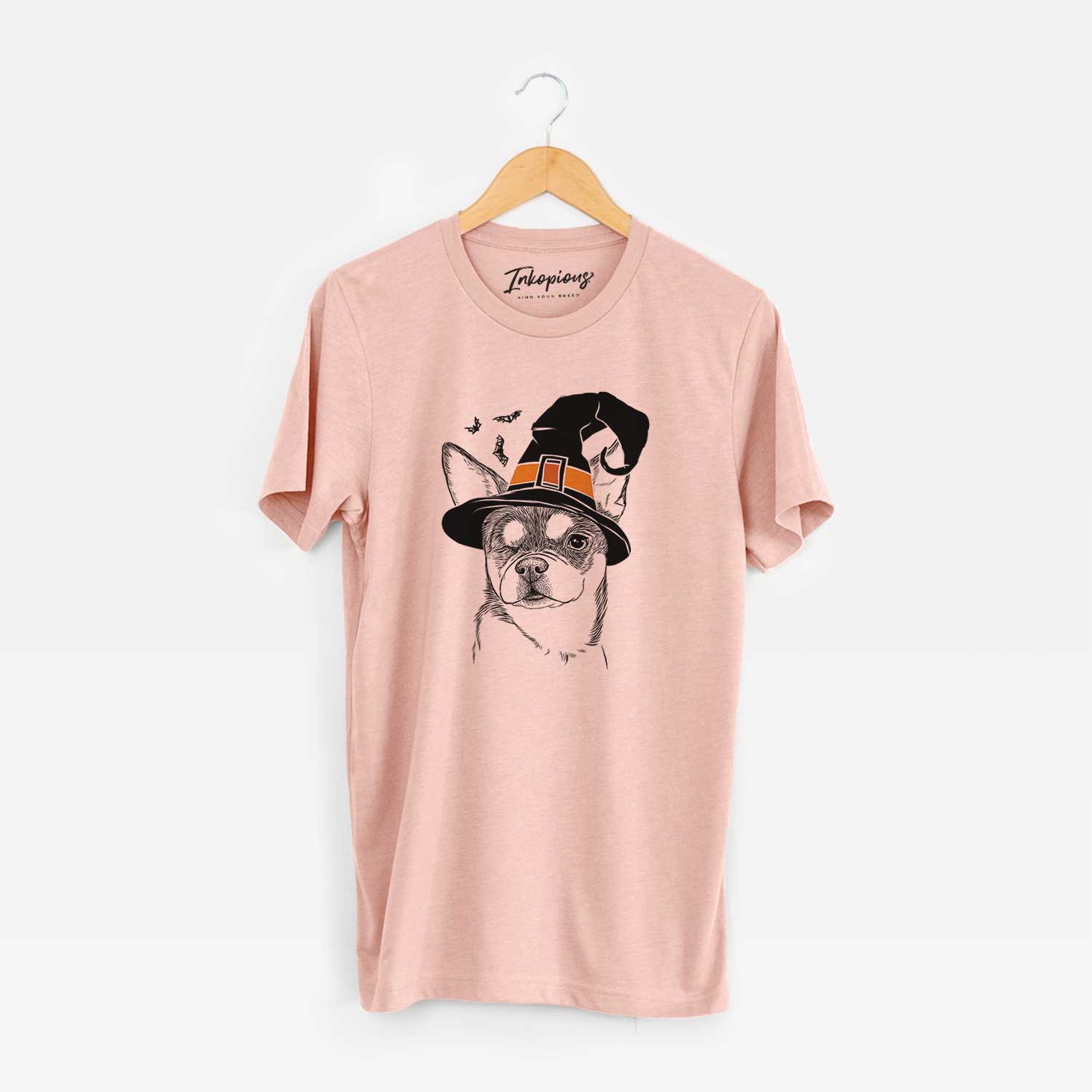 Hand-drawn sketch of Paris the Chihuahua wearing a witch hat on a Peach Unisex crewneck