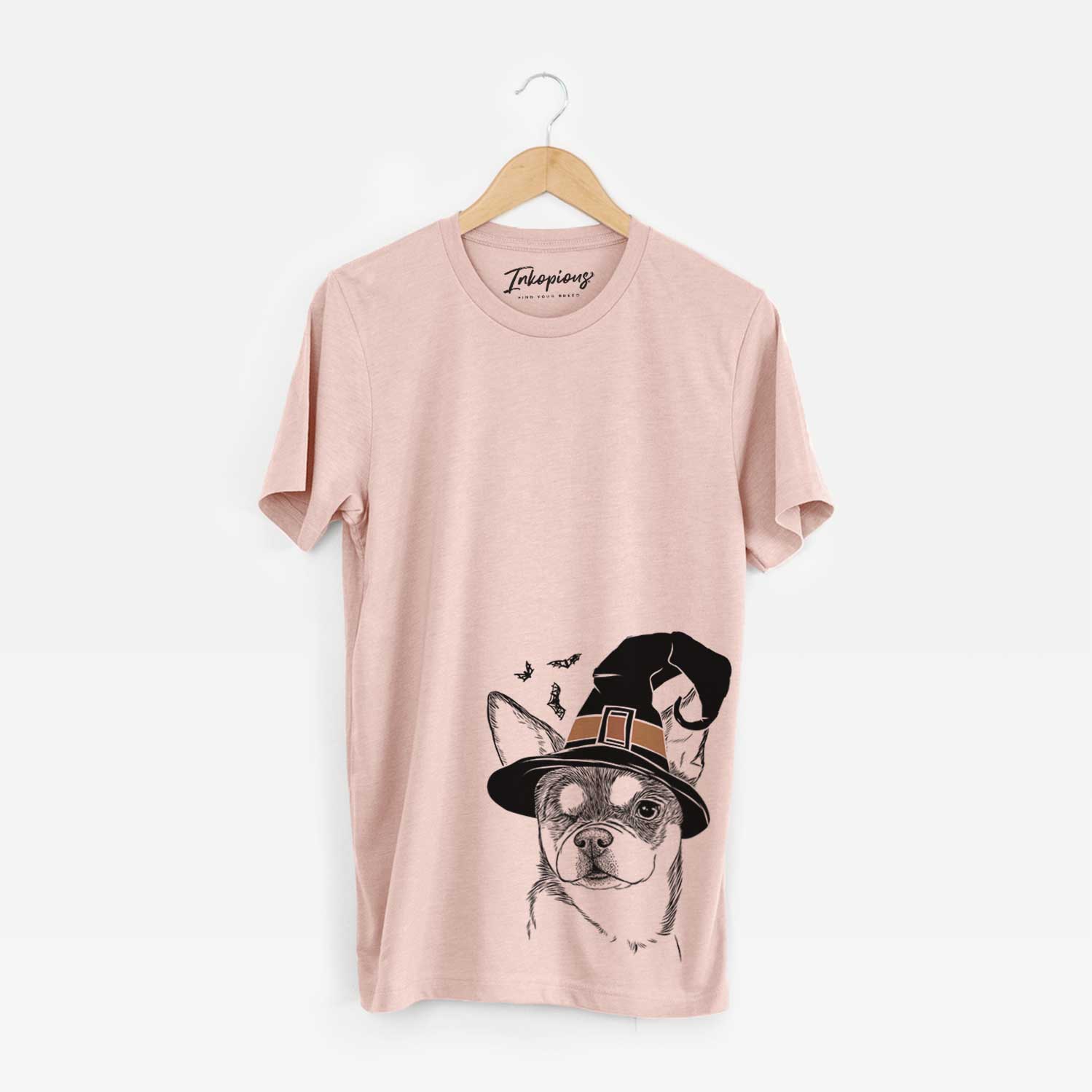 Hand-drawn sketch of Paris the Chihuahua wearing a witch hat on a Peach Unisex crewneck