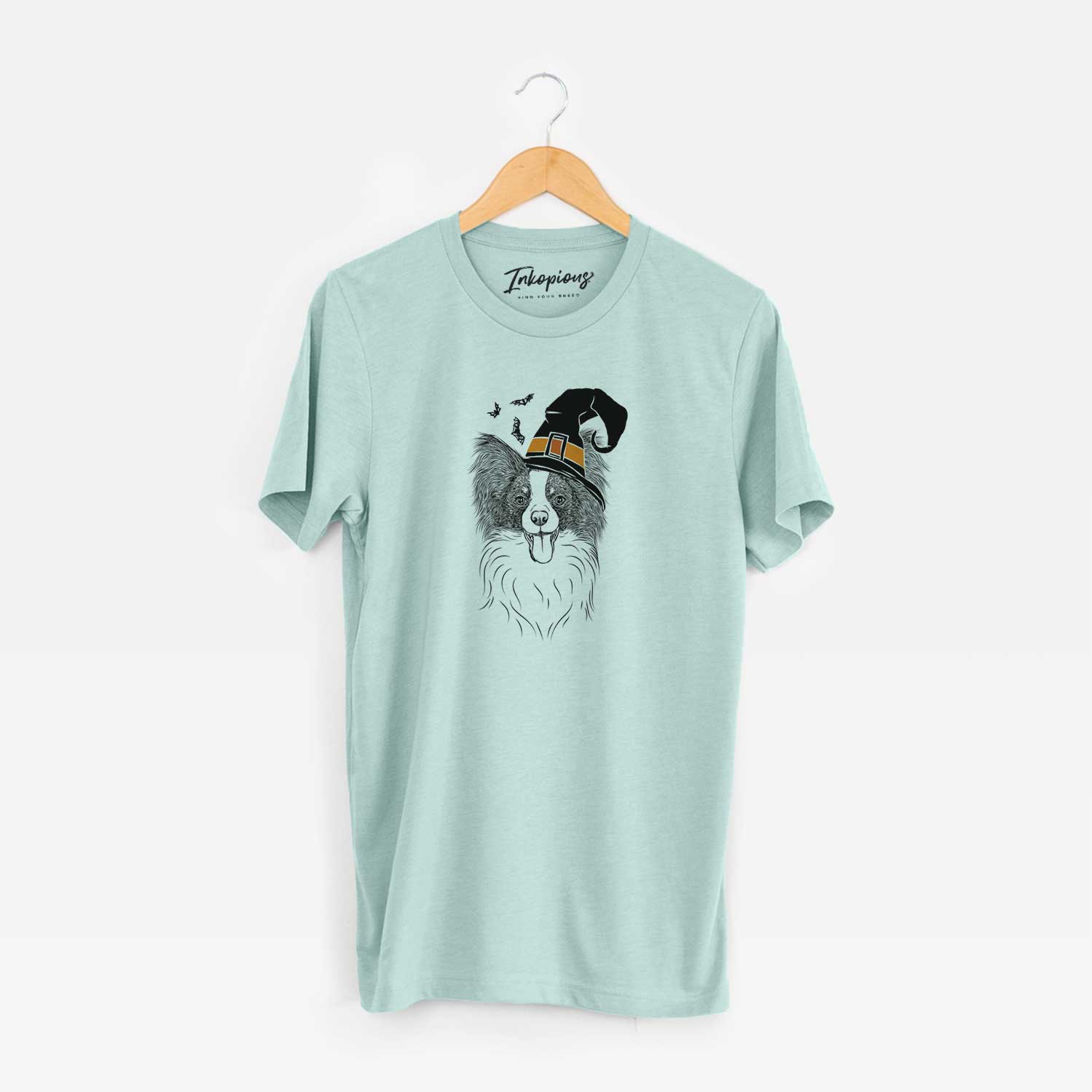 Hand-drawn sketch of Patrick the Papillon wearing a witch hat on a Heather Sage Unisex crewneck