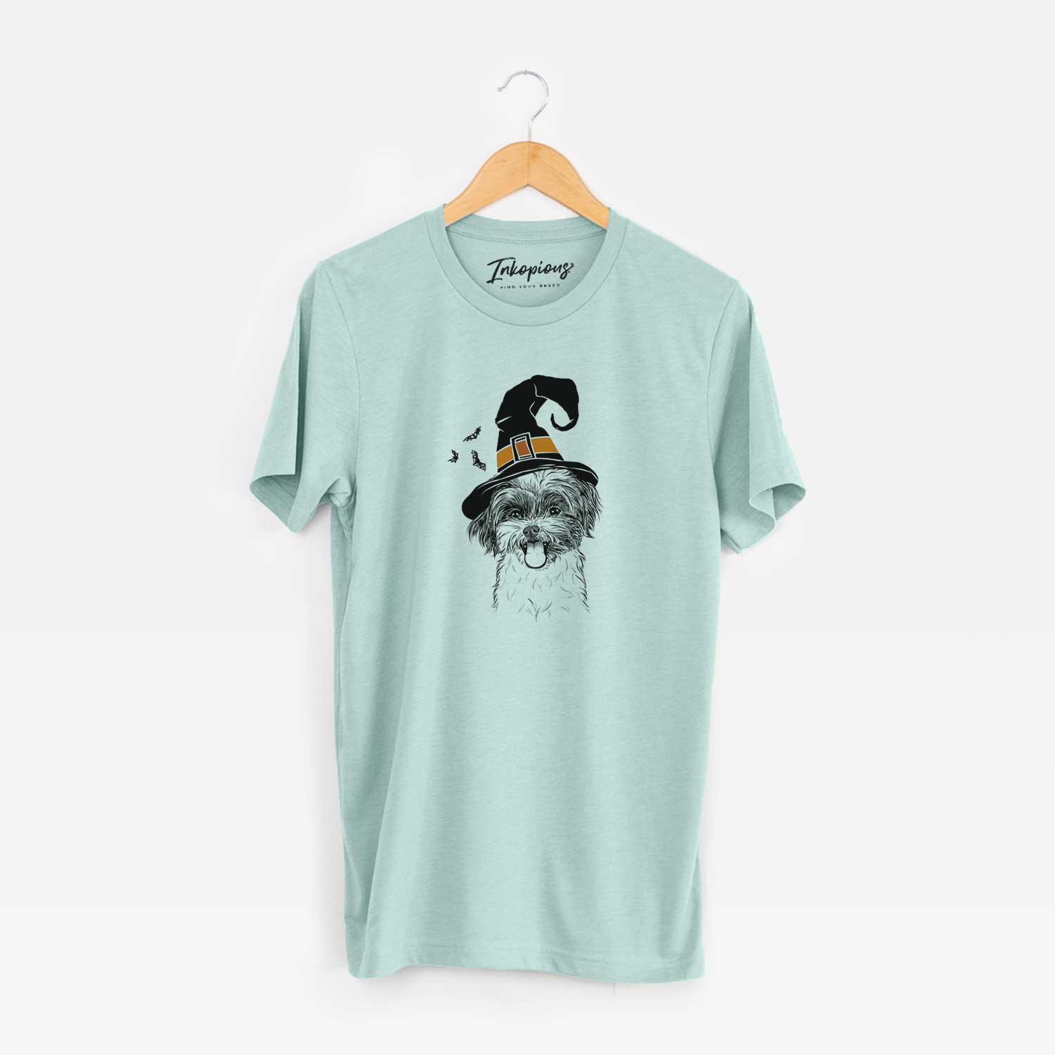 Hand-drawn sketch of Pepper the Shihpoo wearing a witch hat on a Heather Sage Unisex crewneck