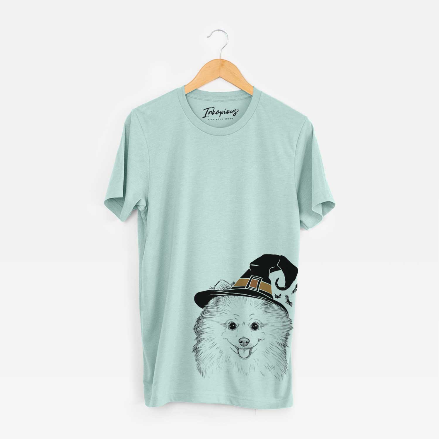 Hand-drawn sketch of Piper Jo the Pomeranian wearing a witch hat on a Heather Sage Unisex crewneck