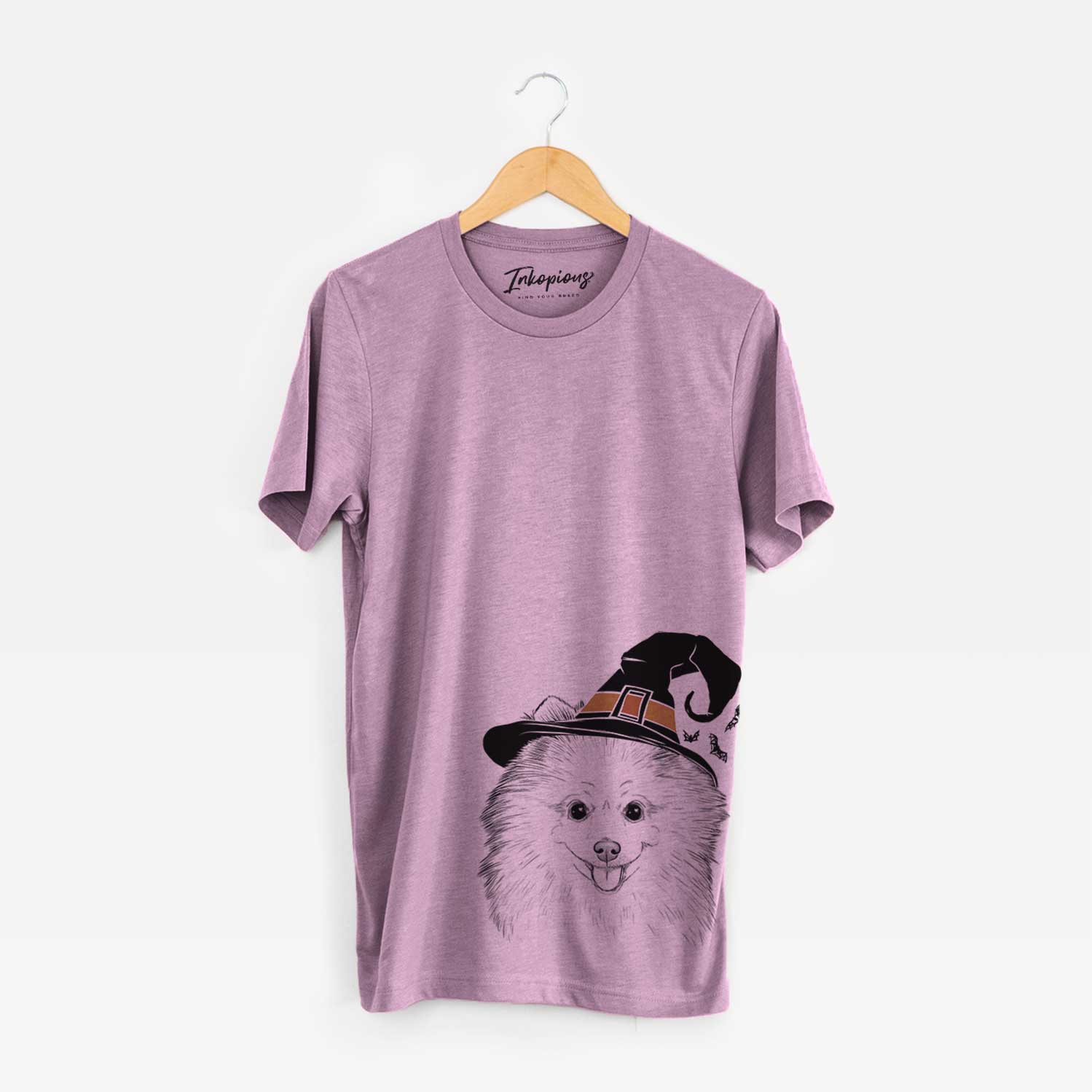 Hand-drawn sketch of Piper Jo the Pomeranian wearing a witch hat on an Orchid Unisex crewneck