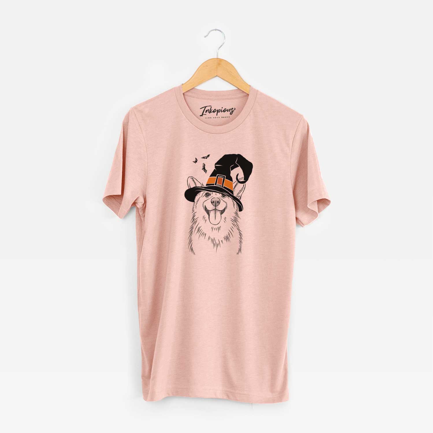 Hand-drawn sketch of Porter the Pembroke Welsh Corgi wearing a witch hat on a Peach Unisex crewneck