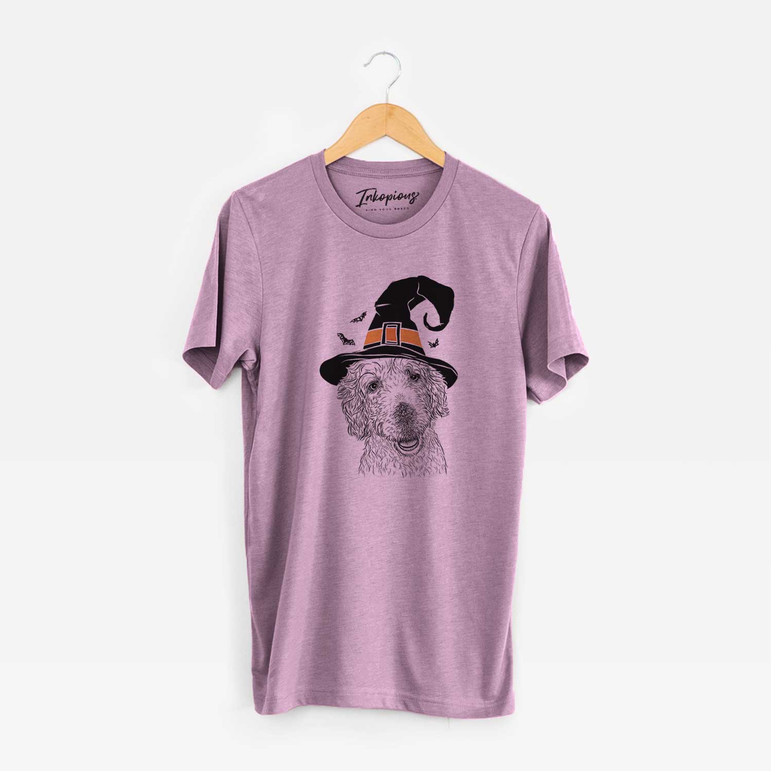 Hand-drawn sketch of Preston the Labradoodle wearing a witch hat on an Orchid Unisex crewneck