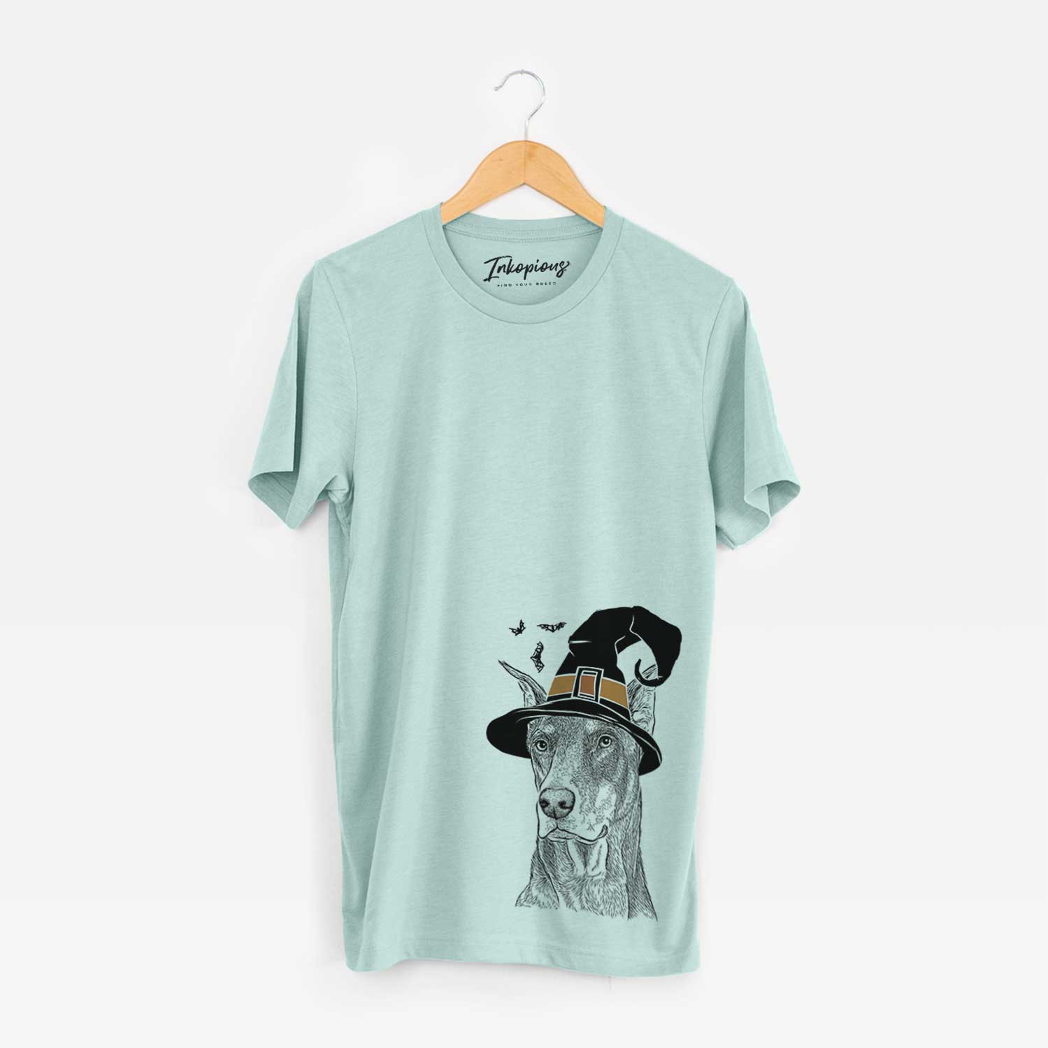 Hand-drawn sketch of RJ the Doberman Pinscher wearing a witch hat on a Heather Sage Unisex crewneck