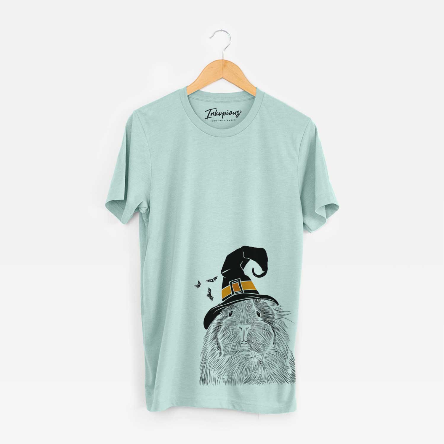 Hand-drawn sketch of Rhino the Guinea Pig wearing a witch hat on a Heather Sage Unisex crewneck