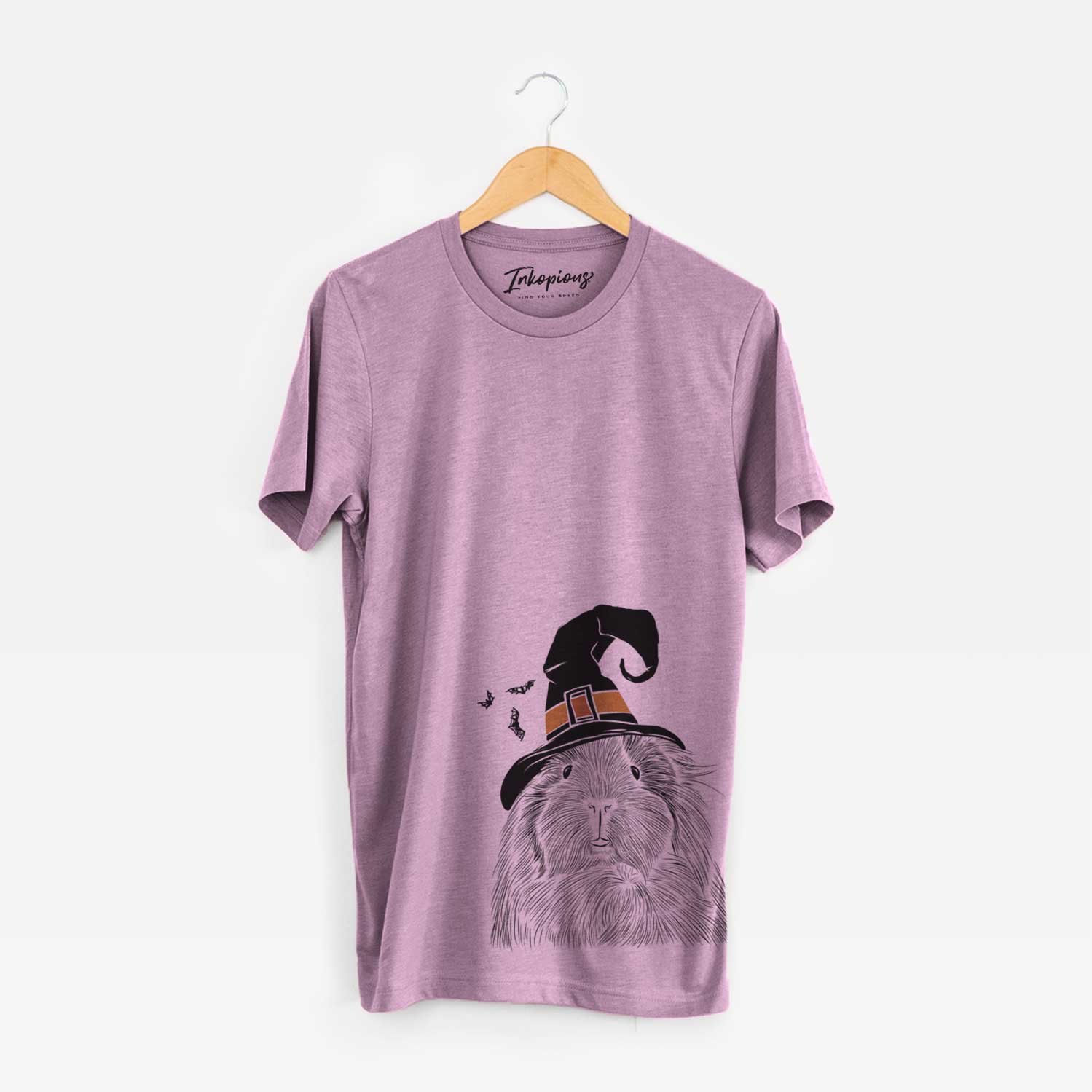 Hand-drawn sketch of Rhino the Guinea Pig wearing a witch hat on an Orchid Unisex crewneck