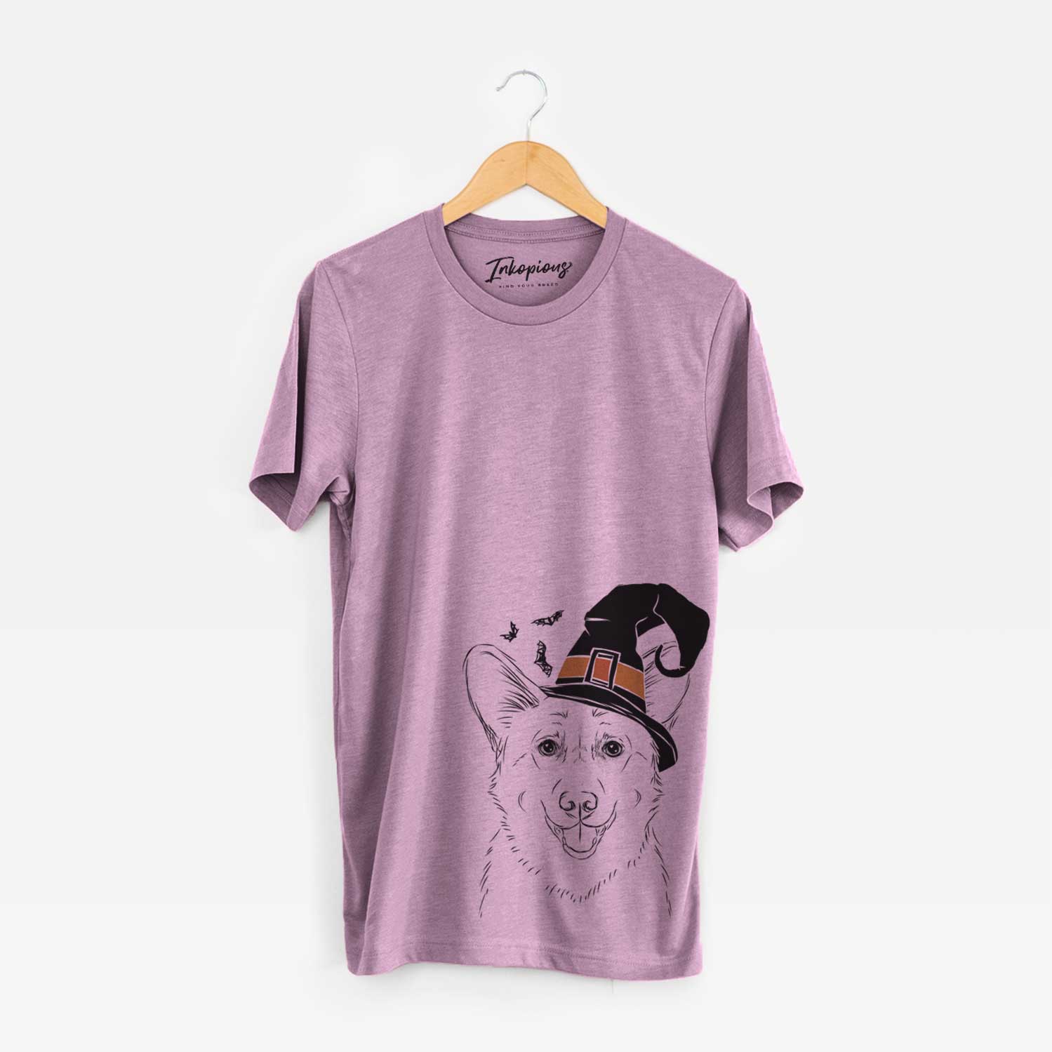 Hand-drawn sketch of Ricco the Corgi wearing a witch hat on an Orchid Unisex crewneck