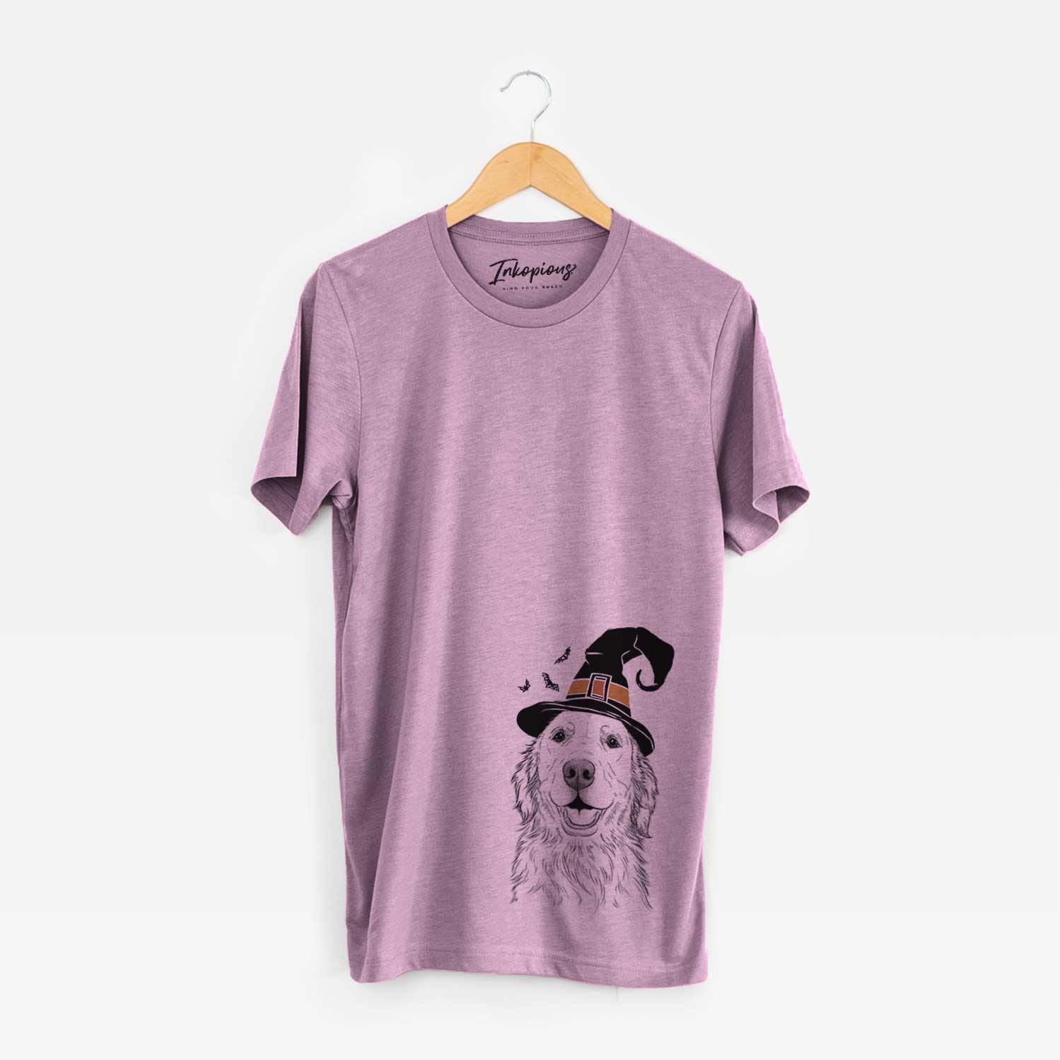 Hand-drawn sketch of Ridge the Golden Retriever wearing a witch hat on an Orchid Unisex crewneck