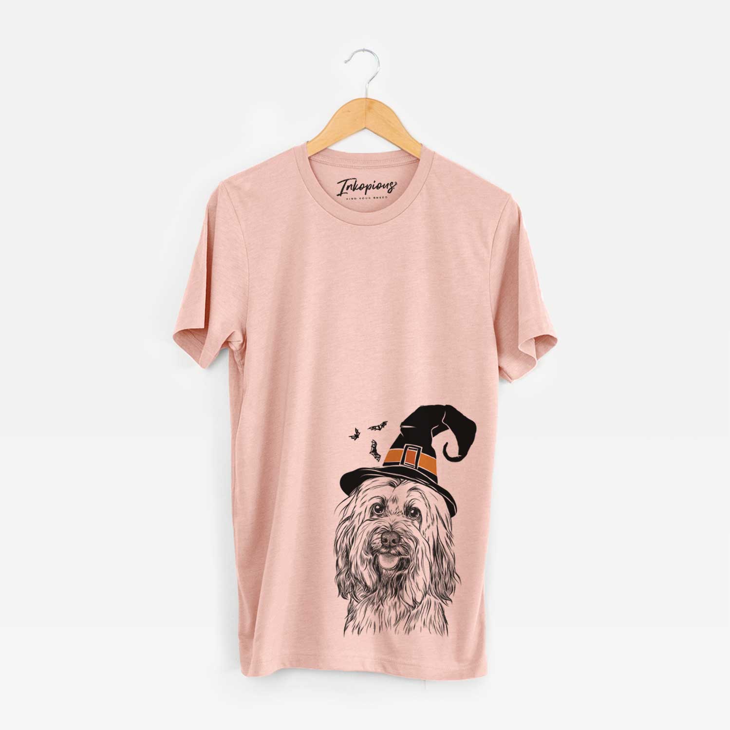 Hand-drawn sketch of Rime the Tibetan Terrier wearing a witch hat on a Peach Unisex crewneck