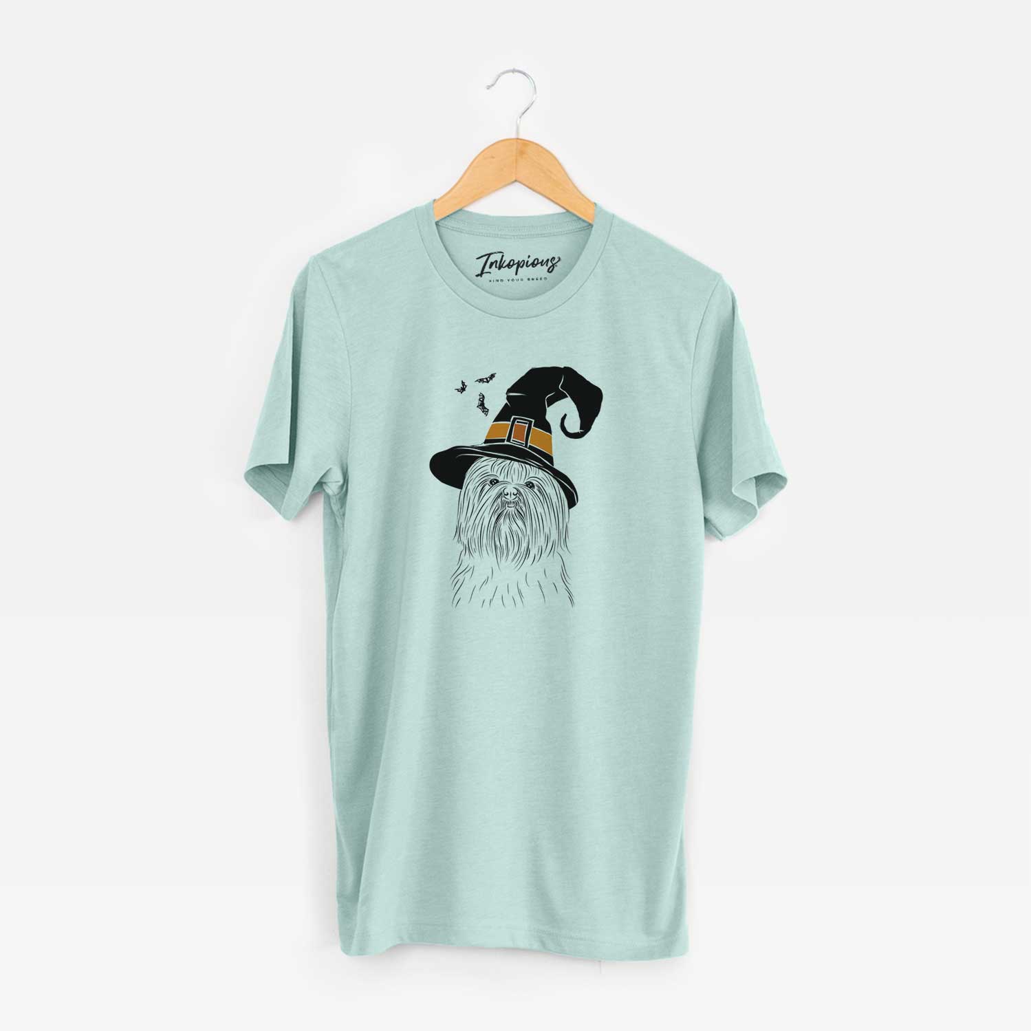 Hand-drawn sketch of Sabine the Shih Tzu wearing a witch hat on a Heather Sage Unisex crewneck